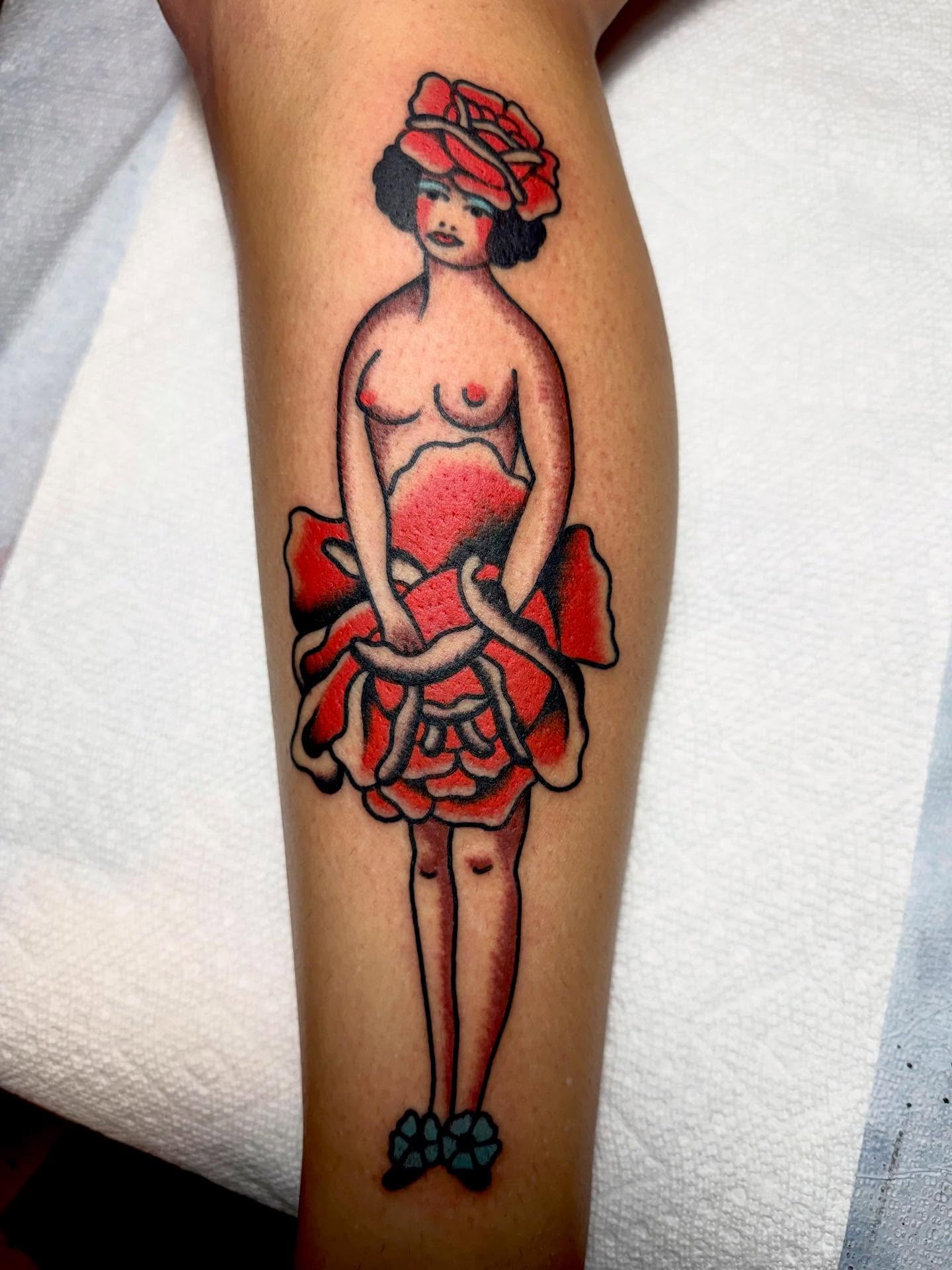 Woman in rose American traditional tattoo on the forearm by San Diego tattoo artist