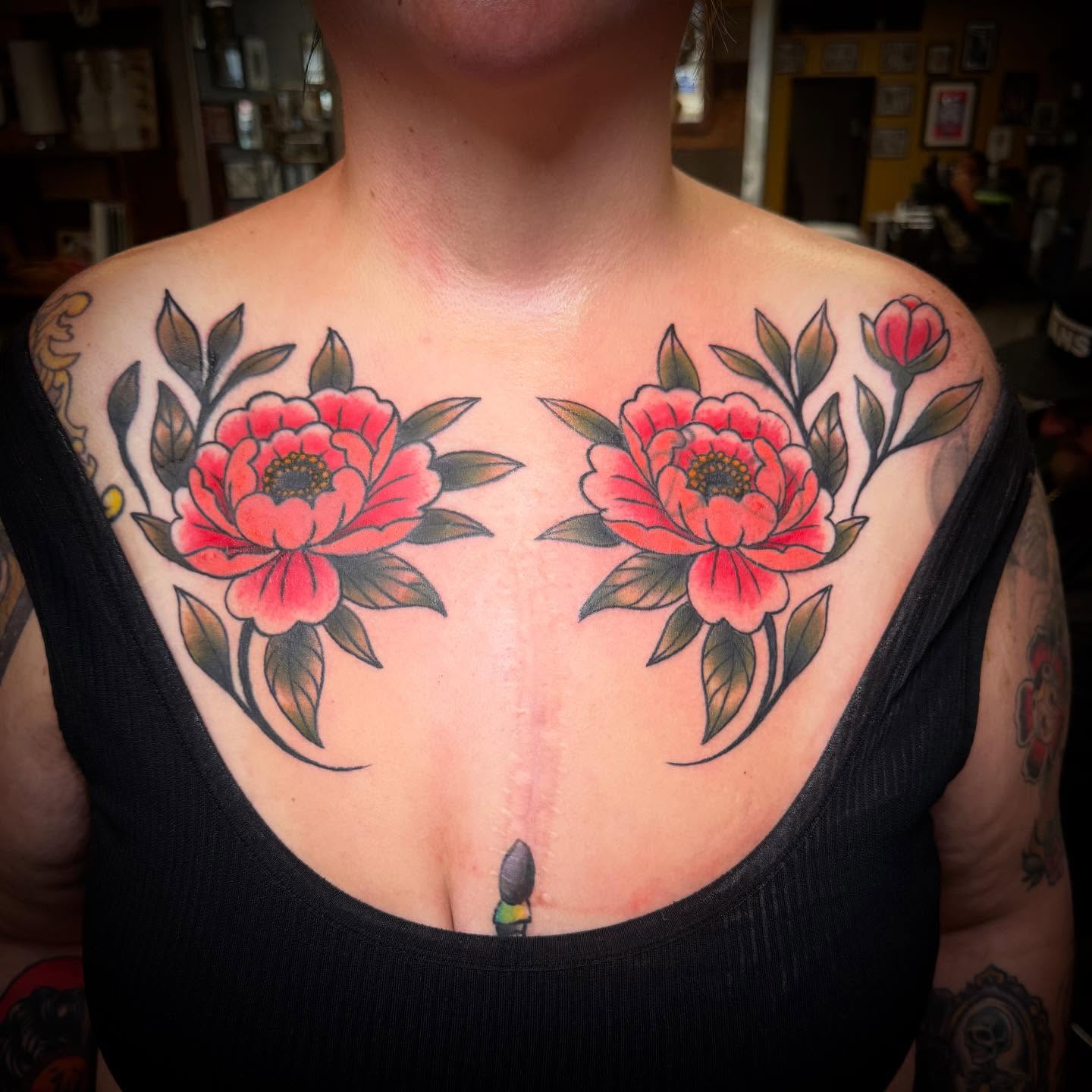 Peony flowers American traditional tattoo on the chest by ArJay Smith