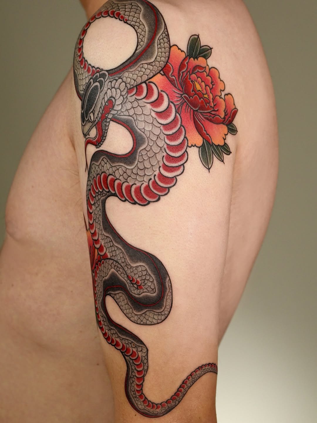 Snake and peony American traditional tattoo on the upper arm by ๐ก๐ฎ๐ป๐ฐ๐ โง ๐ก๐ฌ๐ ๐ง๐๐ง๐ง๐ข๐ข ๐๐ฅ๐ง๐๐ฆ๐งโง