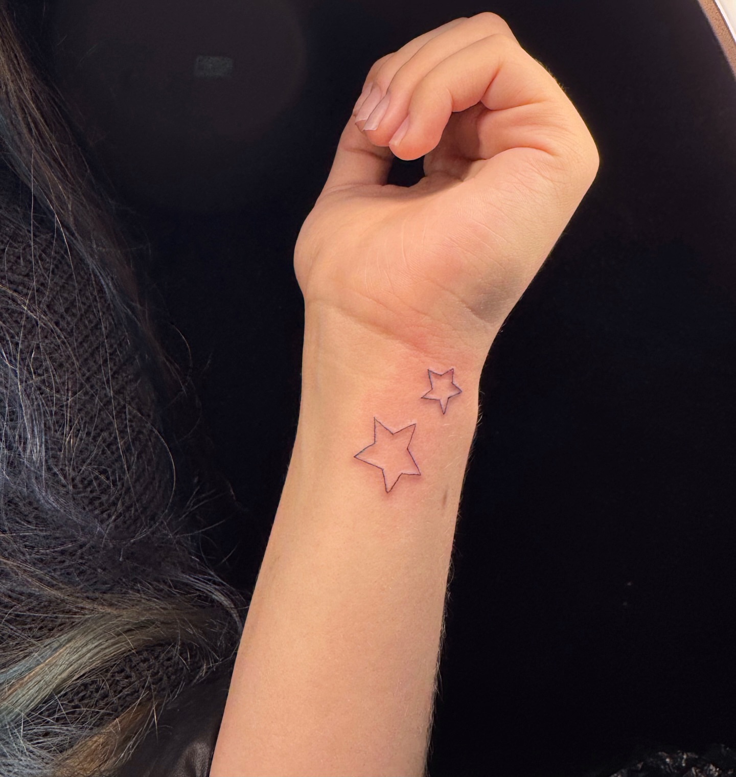 Stars fine line tattoo on the forearm by Nicole