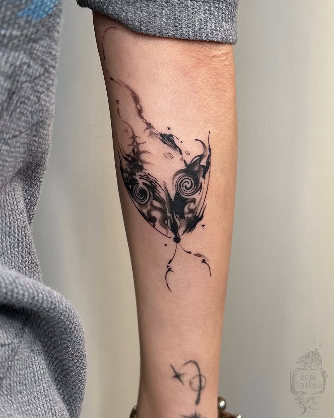 Abstract face sketch tattoo on the forearm by scaitattoo