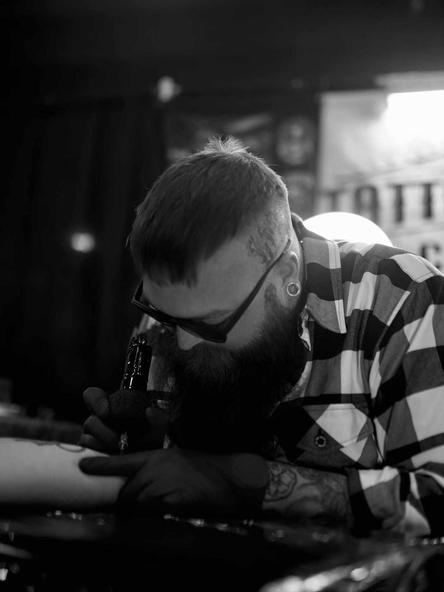 Beard black and grey tattoo on the upper arm by Dylan Fowler
