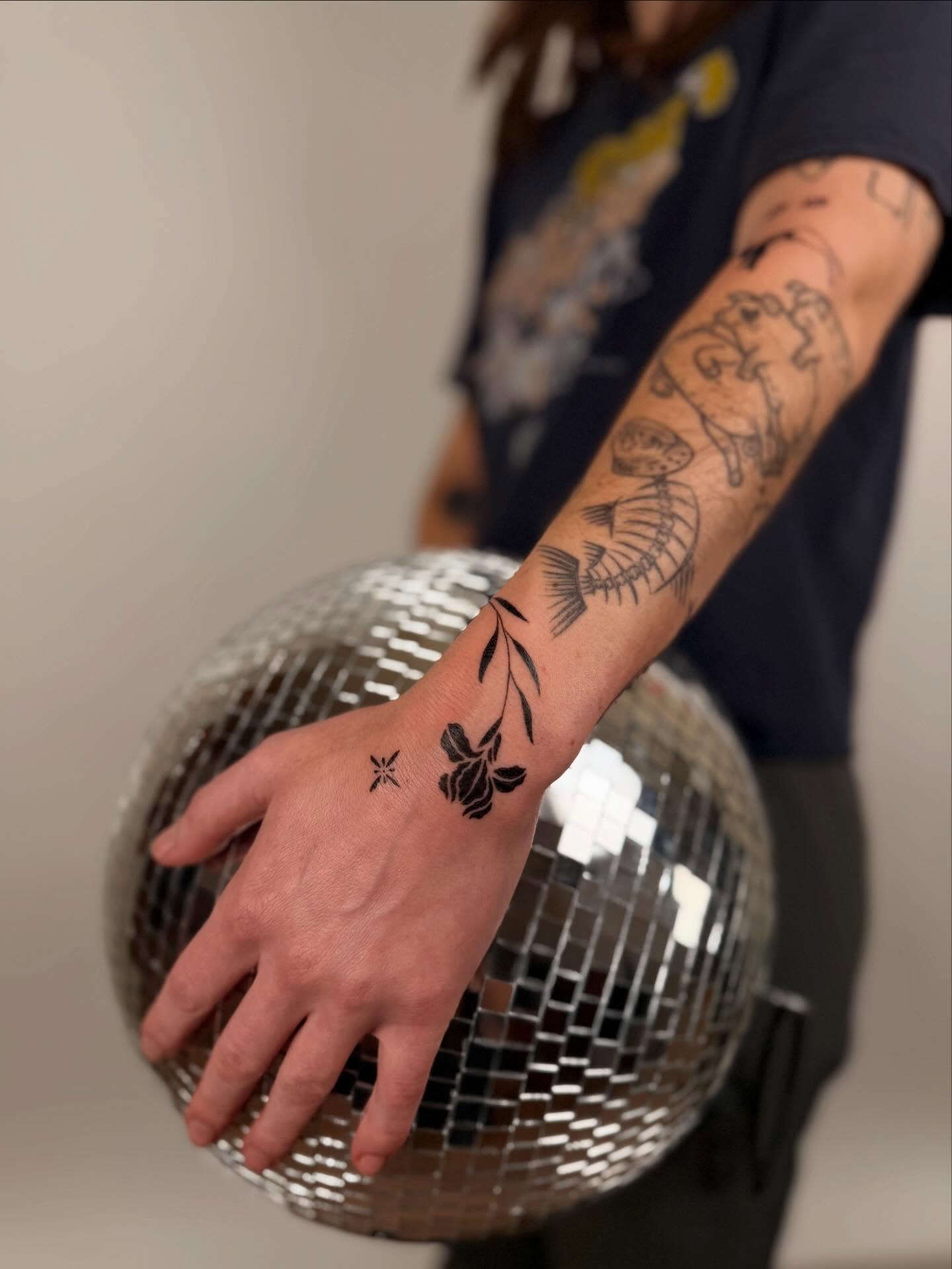 Flower and vine black and grey tattoo on the forearm by b i l l i e, Seattle, Washington