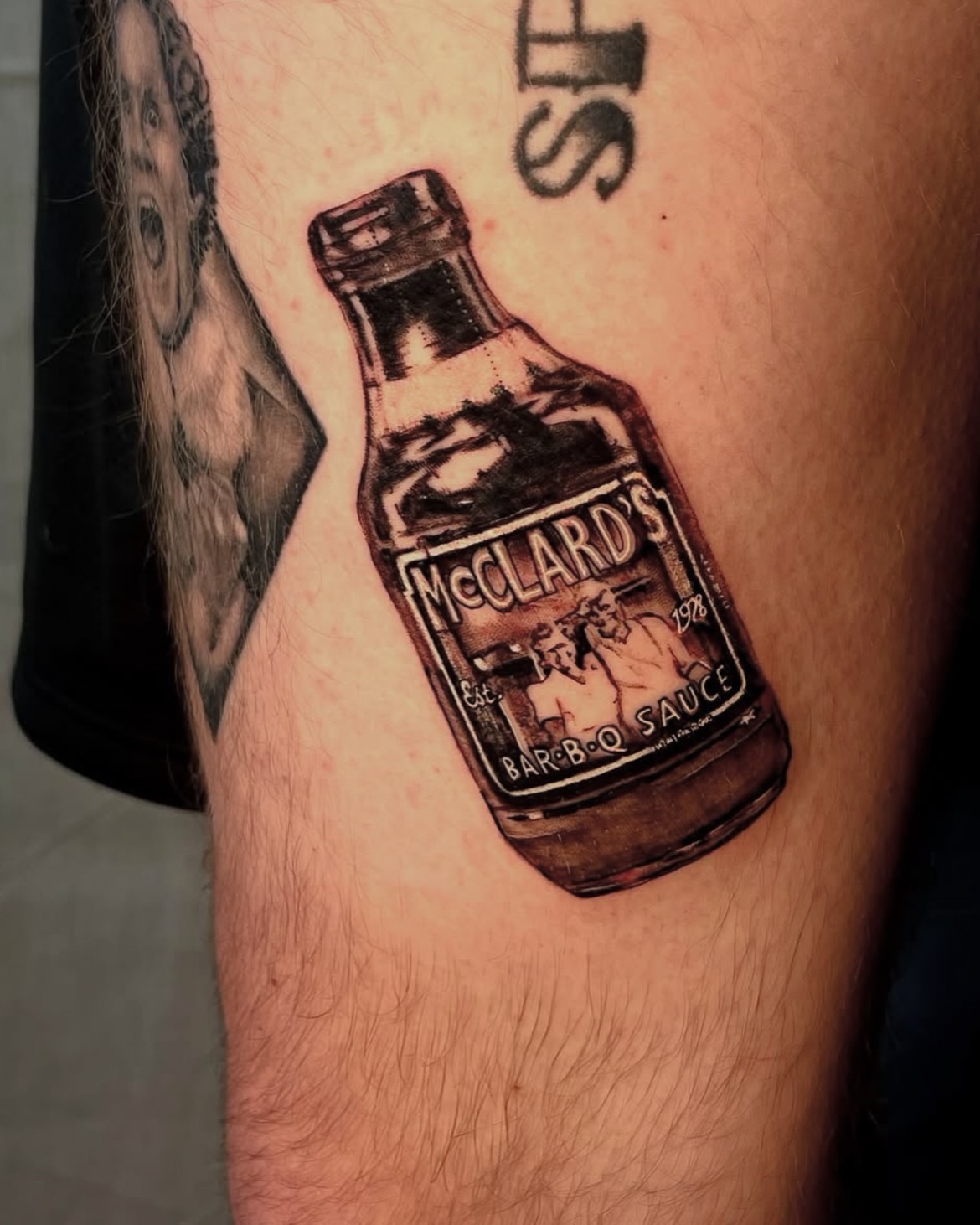 Barbecue sauce bottle realism tattoo on the thigh by Rachel Hanke