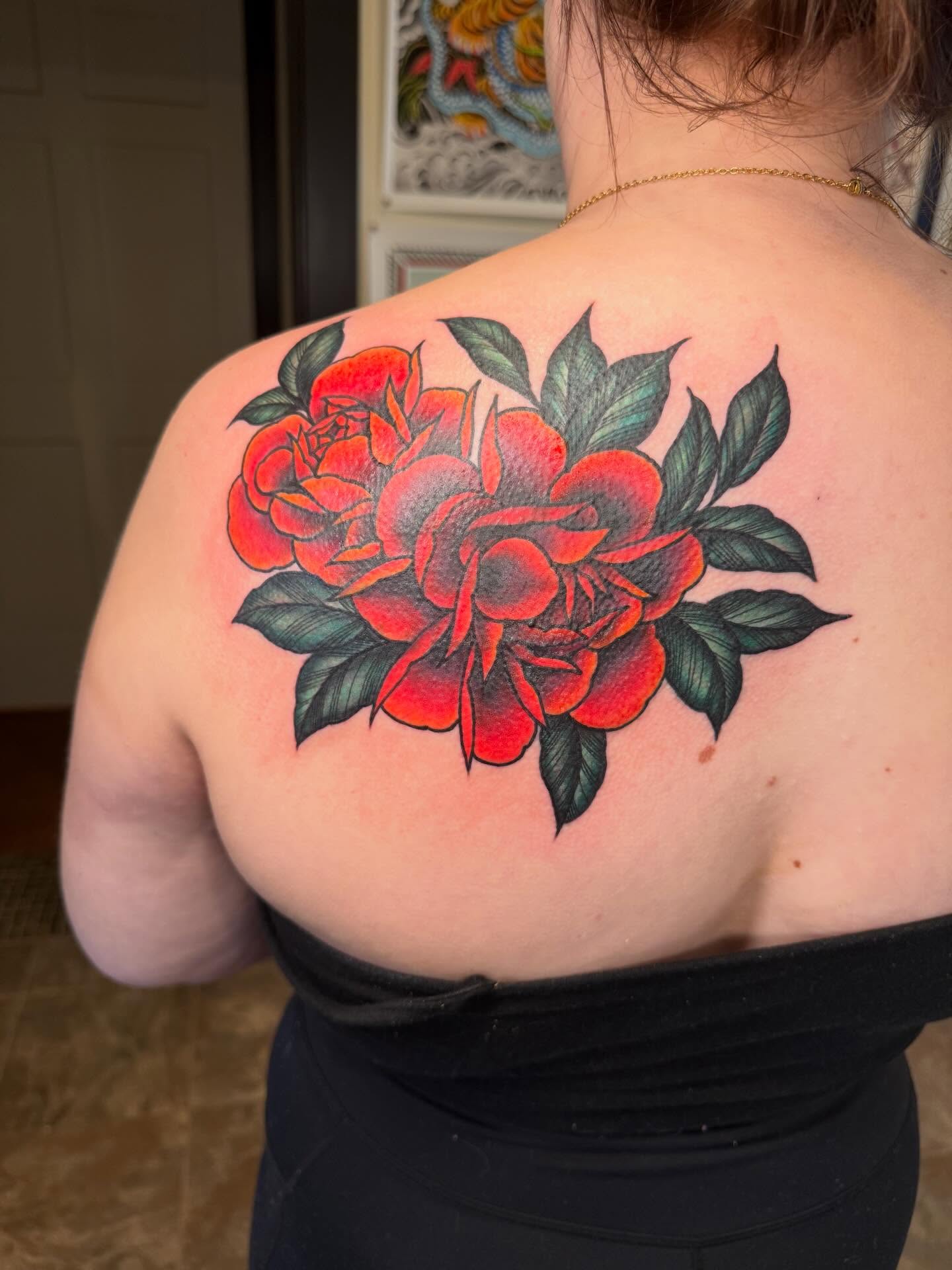 Roses American traditional tattoo on the shoulder by Rebecca Basma Smith