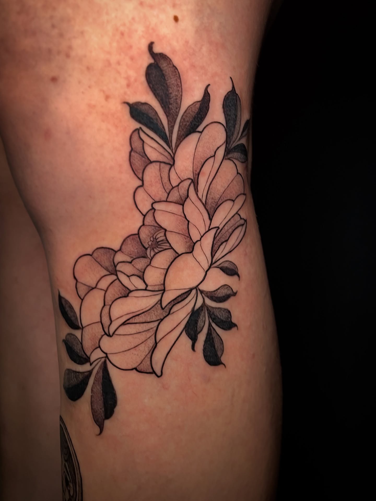 Flower bouquet black and grey tattoo on the forearm by Tanya Murski