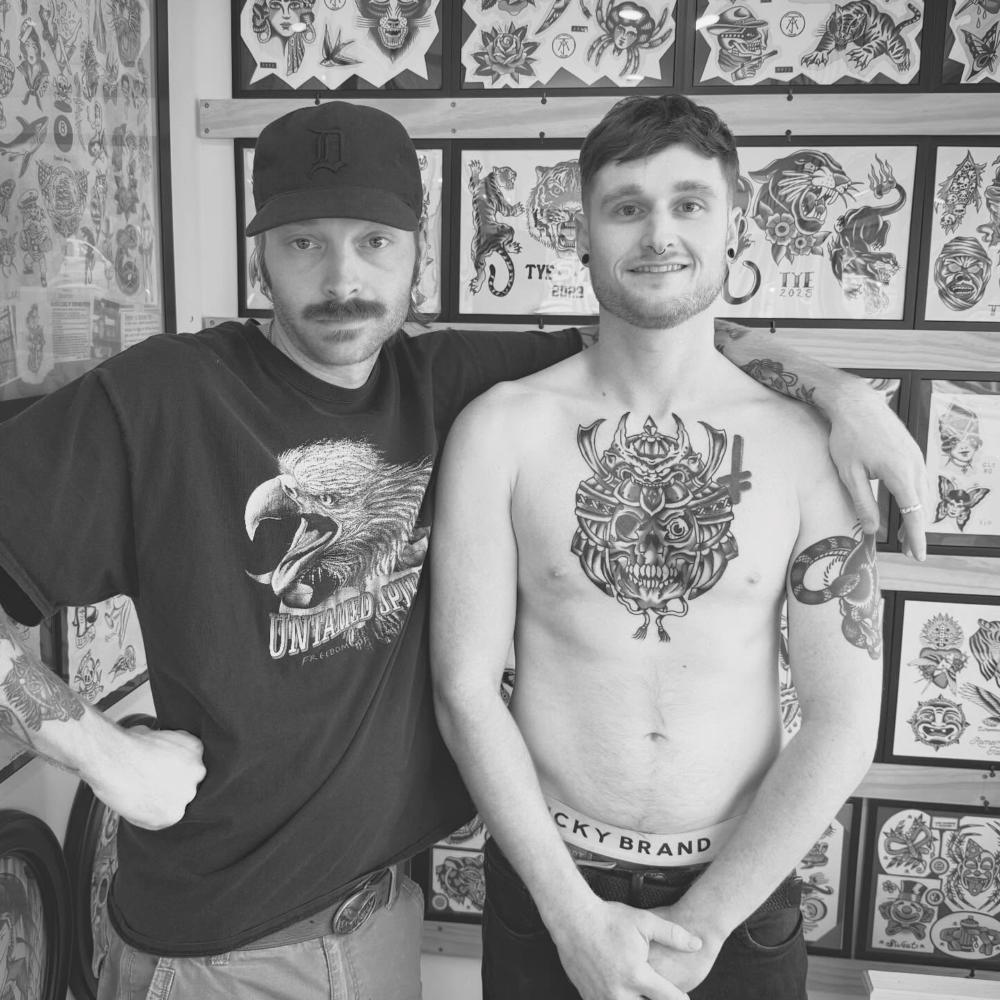 Samurai helmet American traditional tattoo on the chest by Ty Elias