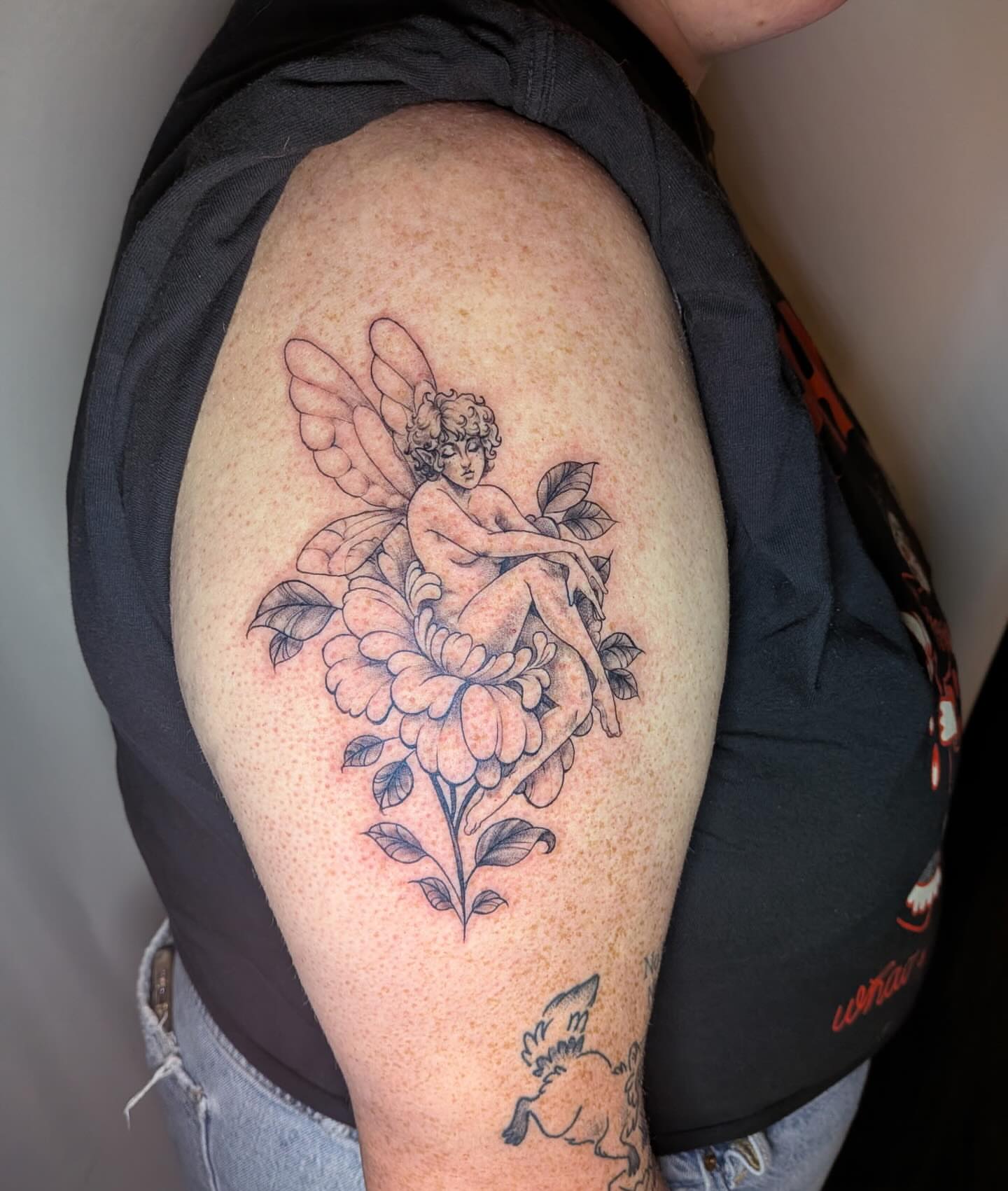 Fairy and flowers black and grey tattoo on the shoulder by Shannon