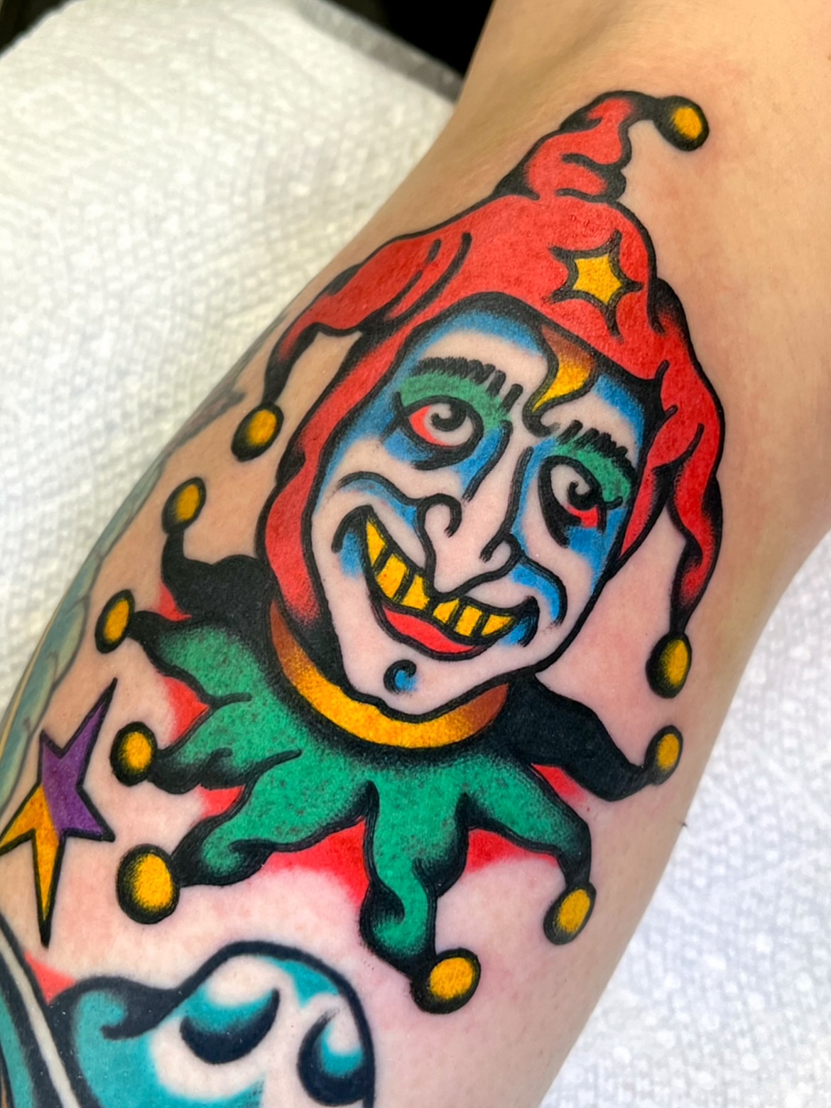 Jester American traditional tattoo on the forearm by π΅ππππ π¬ππππ
