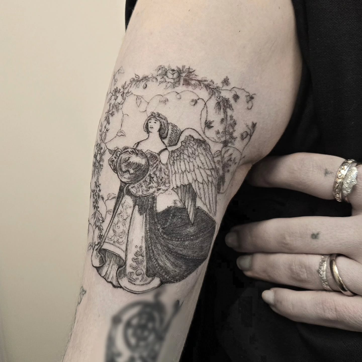 Angel with shield realism tattoo on the forearm by Vintage tattoo