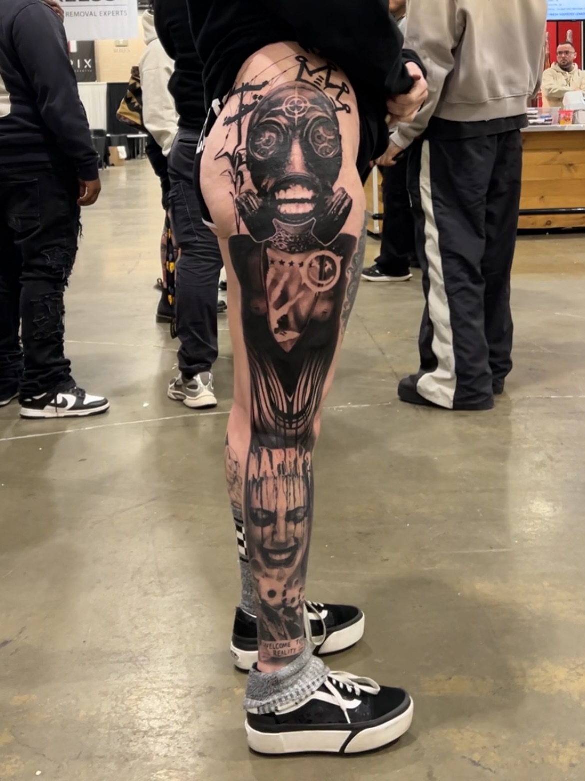 Gas mask realism tattoo on the thigh by Lexi Baker