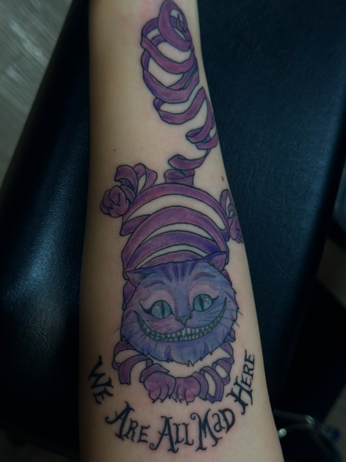 Cheshire Cat new school tattoo on the forearm by jess jené jones, Portland, Oregon