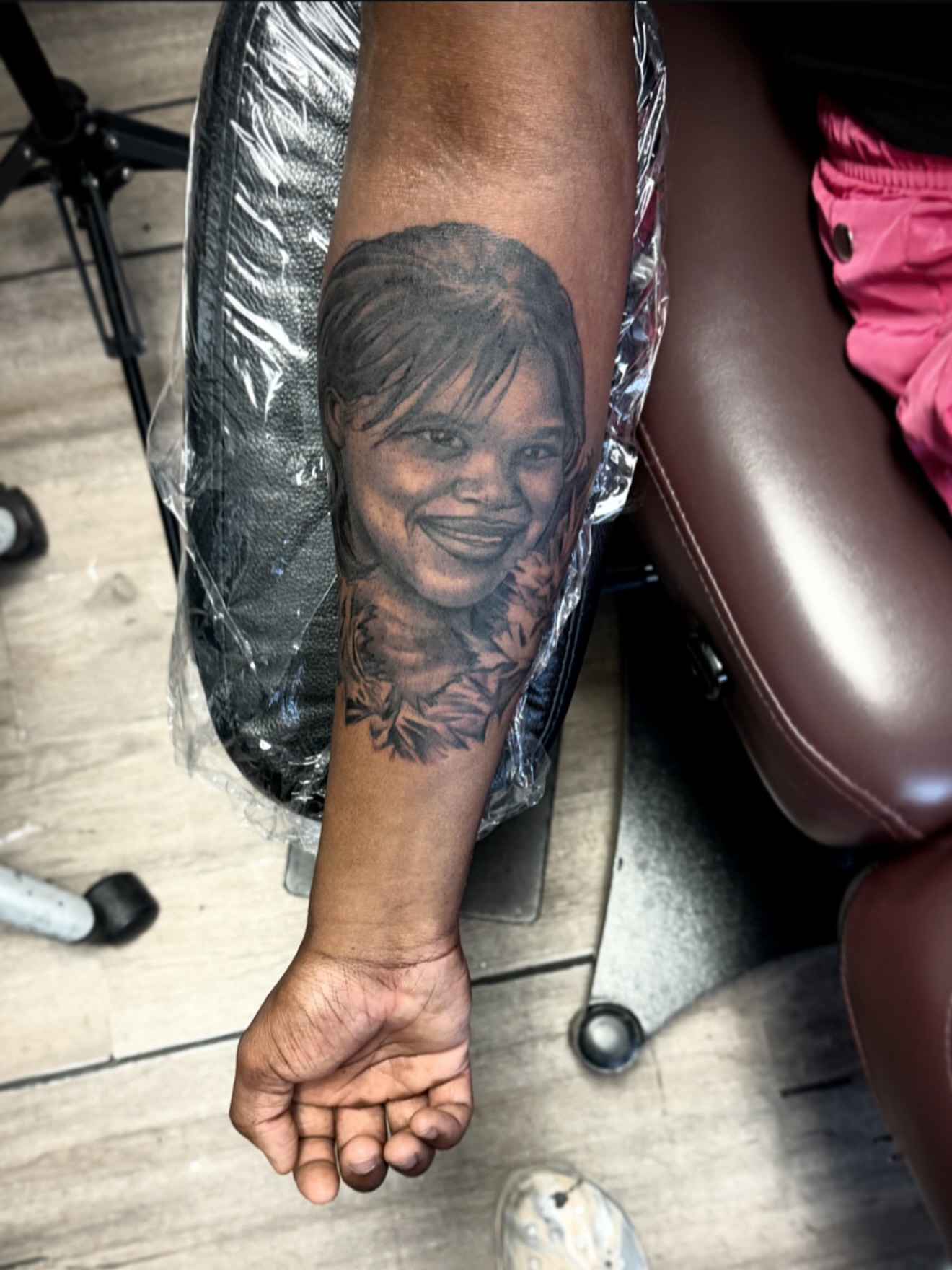 Portrait realism tattoo on the forearm by Jared McGee