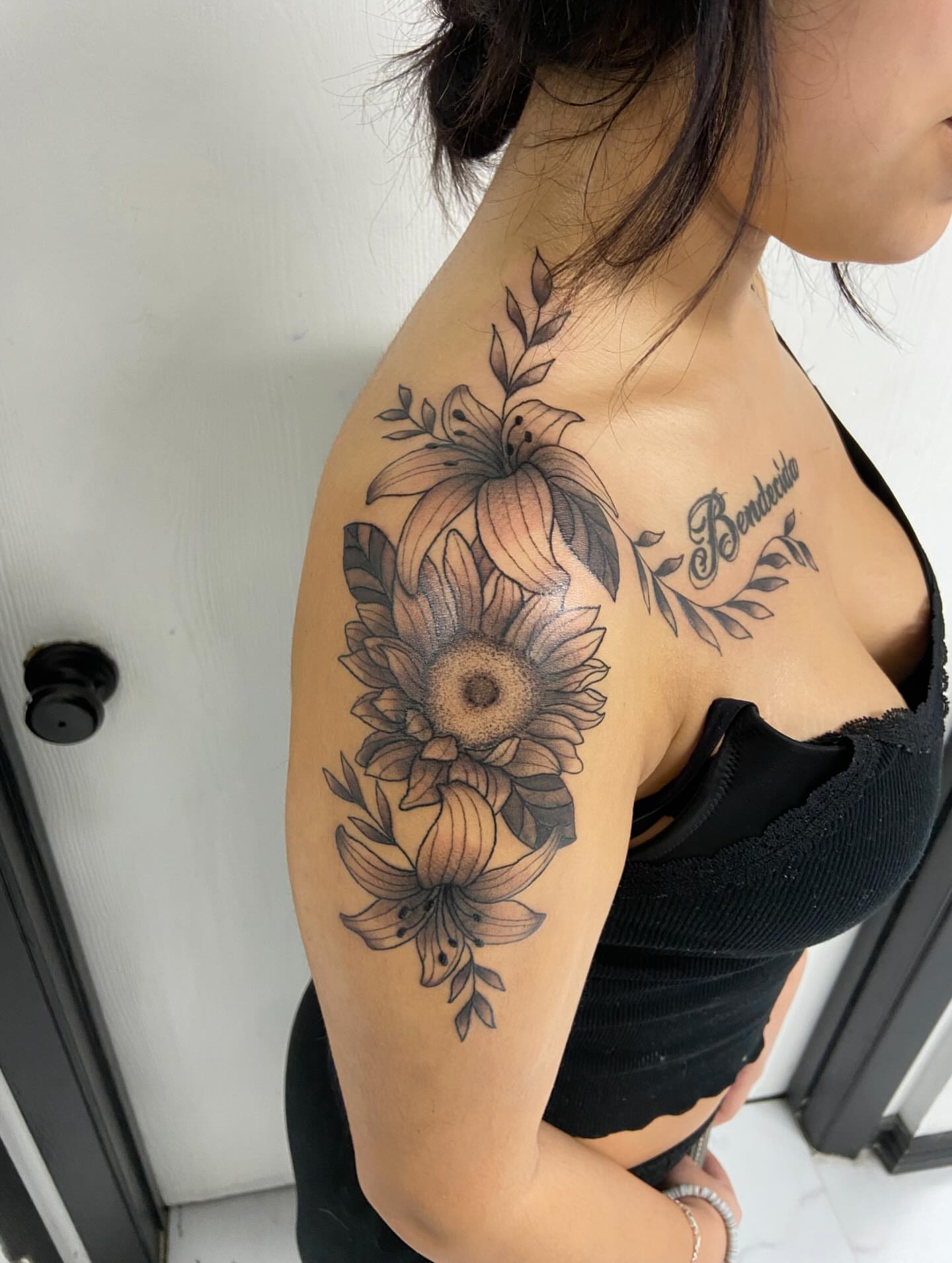 Sunflower bouquet black and grey tattoo on the shoulder by Sophia