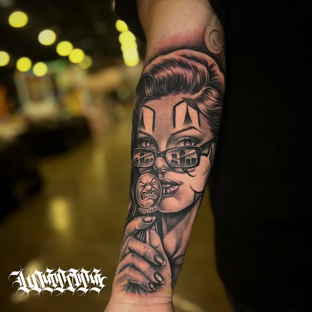 Woman with clown makeup and lollipop Chicano tattoo on the forearm by LOS