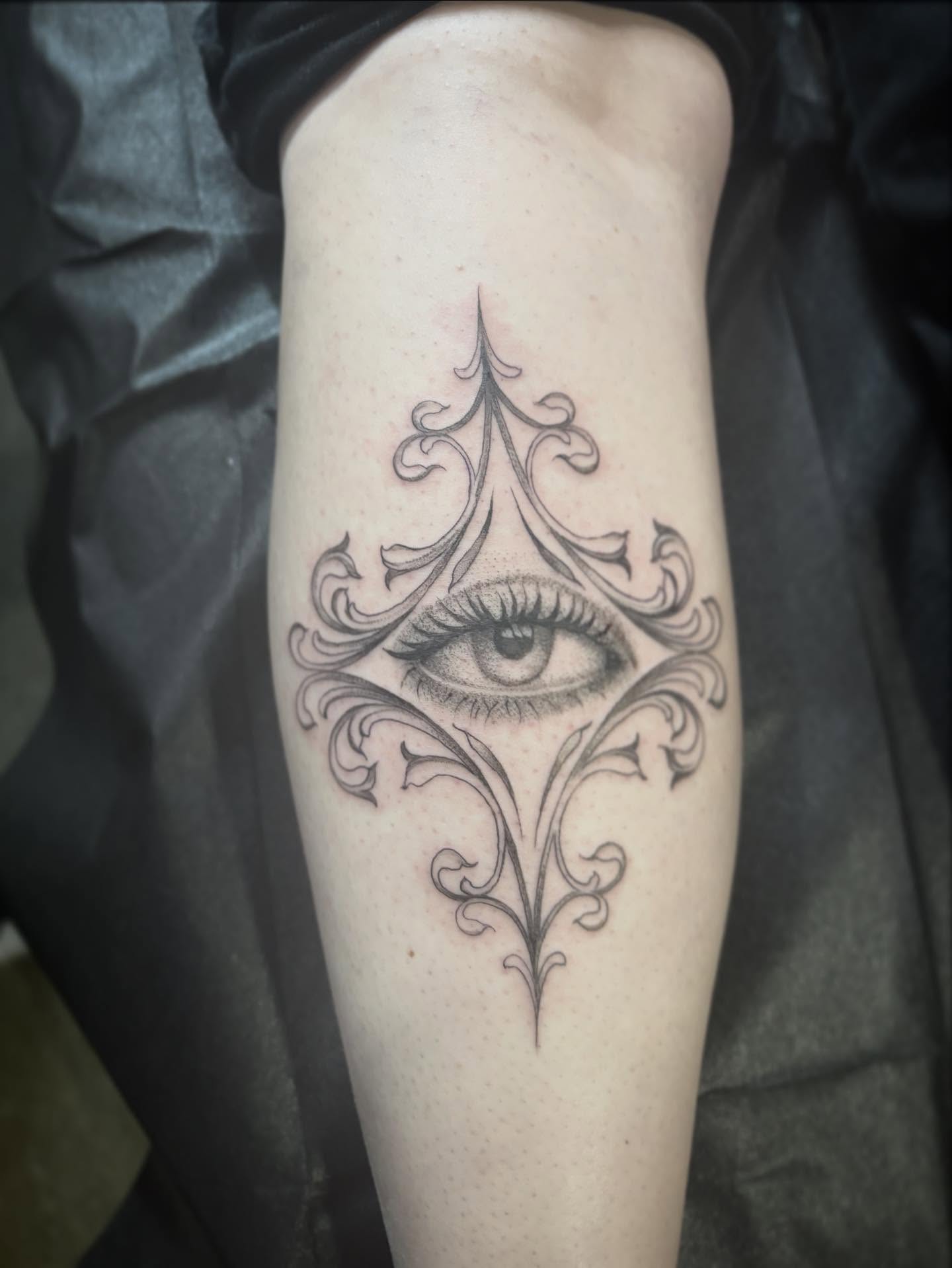 Eye with ornamental design realism tattoo on the forearm by Cassandra Colleen