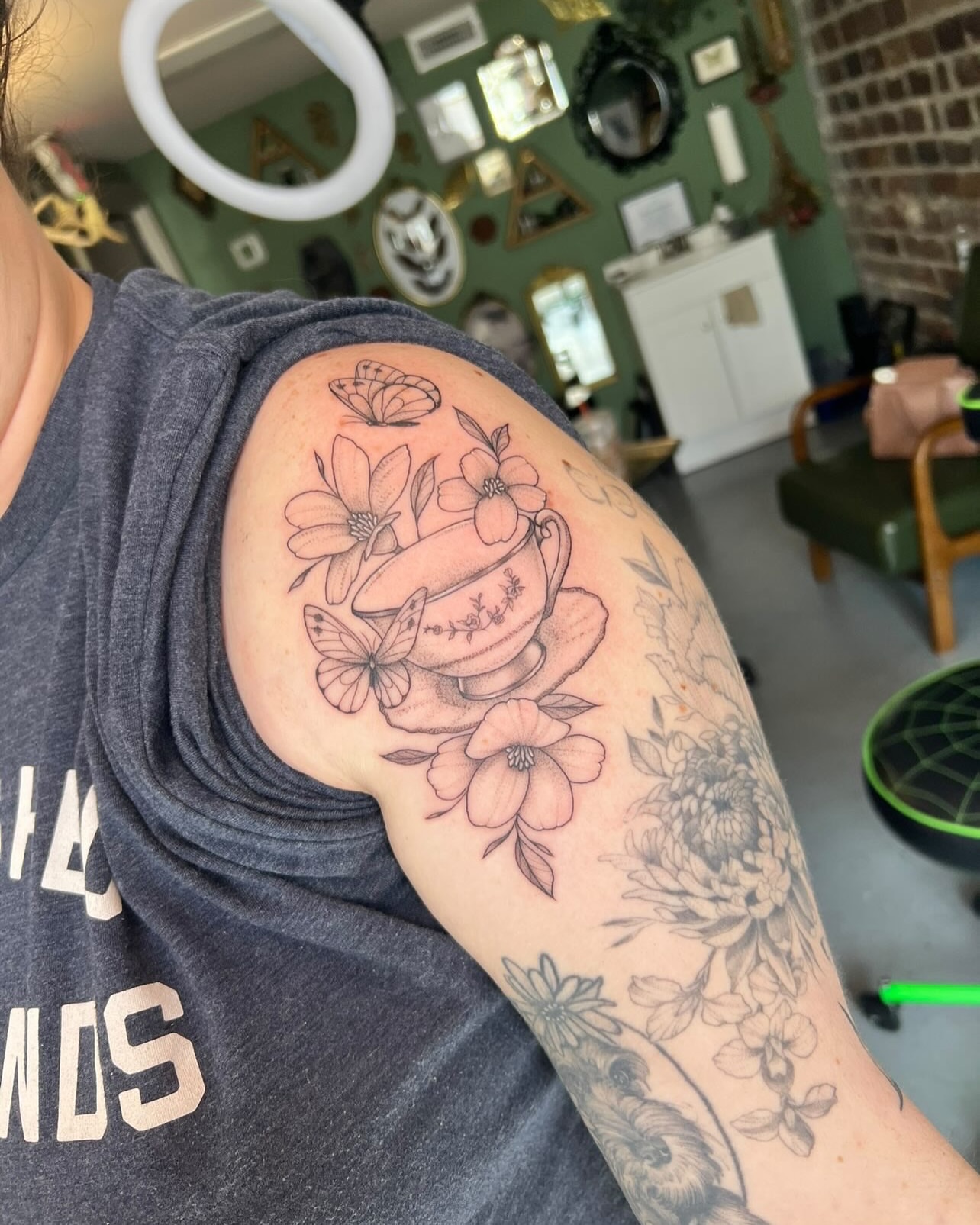 Teacup and flowers black and grey tattoo on the shoulder by ✶ H A N N A H K A y ✶
