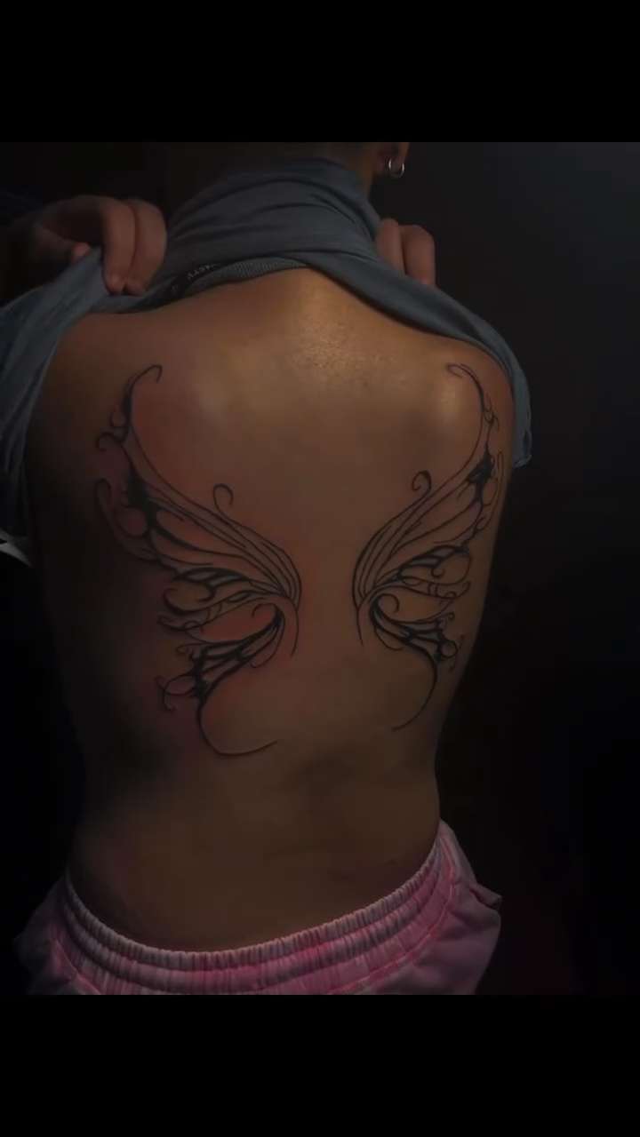 Fairy wings on back blackwork tattoo on the back by Mc X Happo