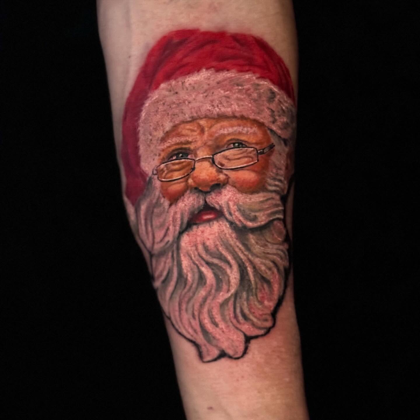 Santa Claus realism tattoo on the forearm by Jacob Bettker, Centerville, Ohio