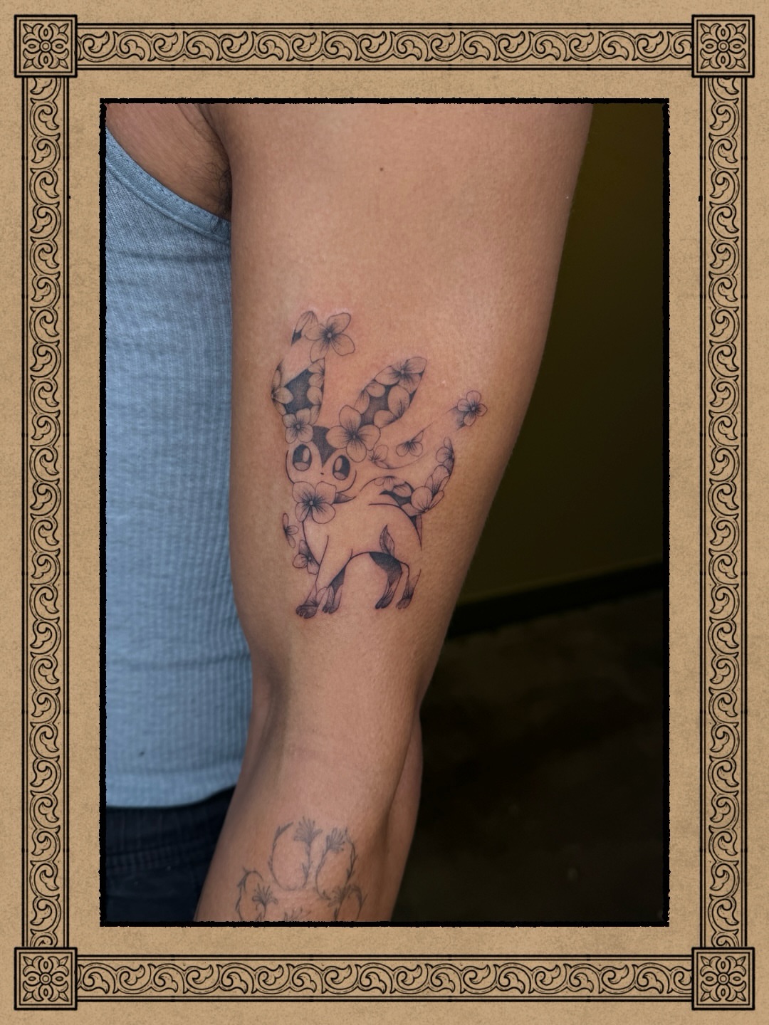 Rabbit with flowers black and grey tattoo on the forearm by Fabian💉 Tattoo artist