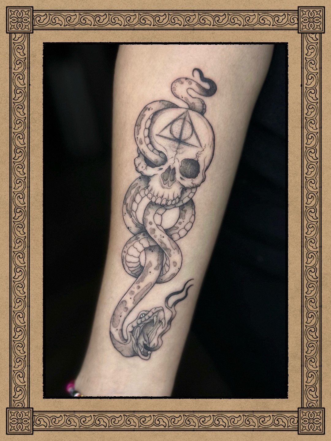 Snake and skull geometric tattoo on the forearm by Fabian💉 Tattoo artist
