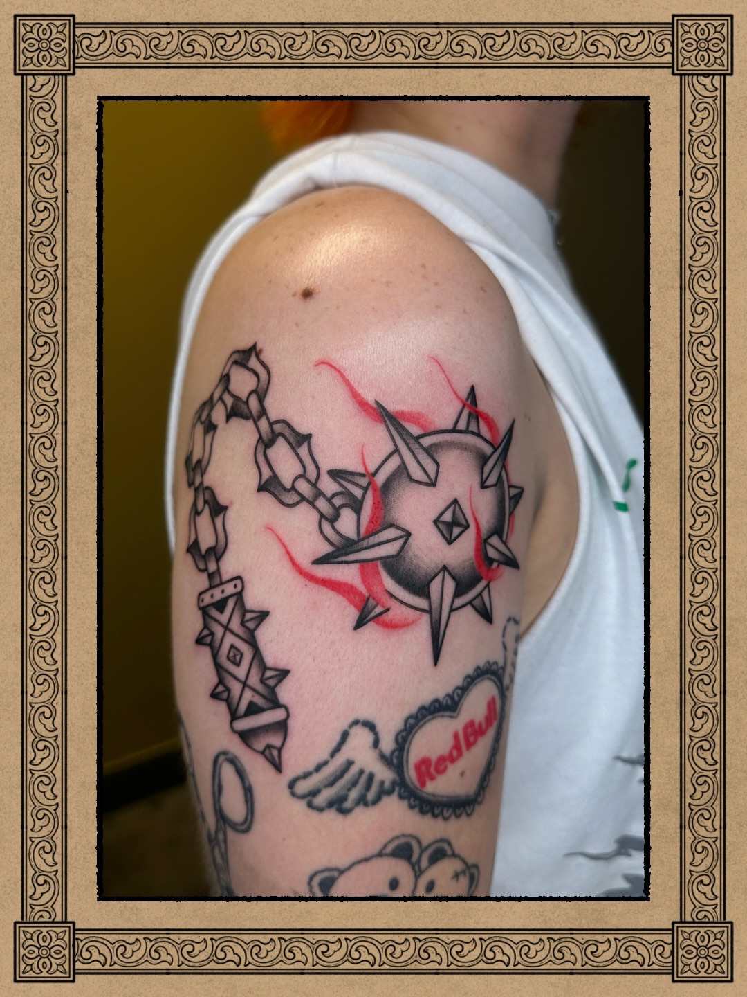Spiked shield and chain neo-traditional tattoo on the shoulder by Fabian💉 Tattoo artist