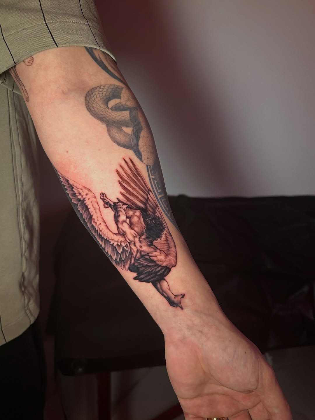 Angelic figure realism tattoo on the forearm by Dennis Alejandro