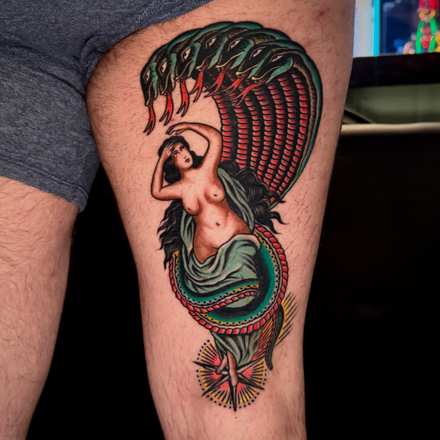 Snake and woman American traditional tattoo on the thigh by Pavel
