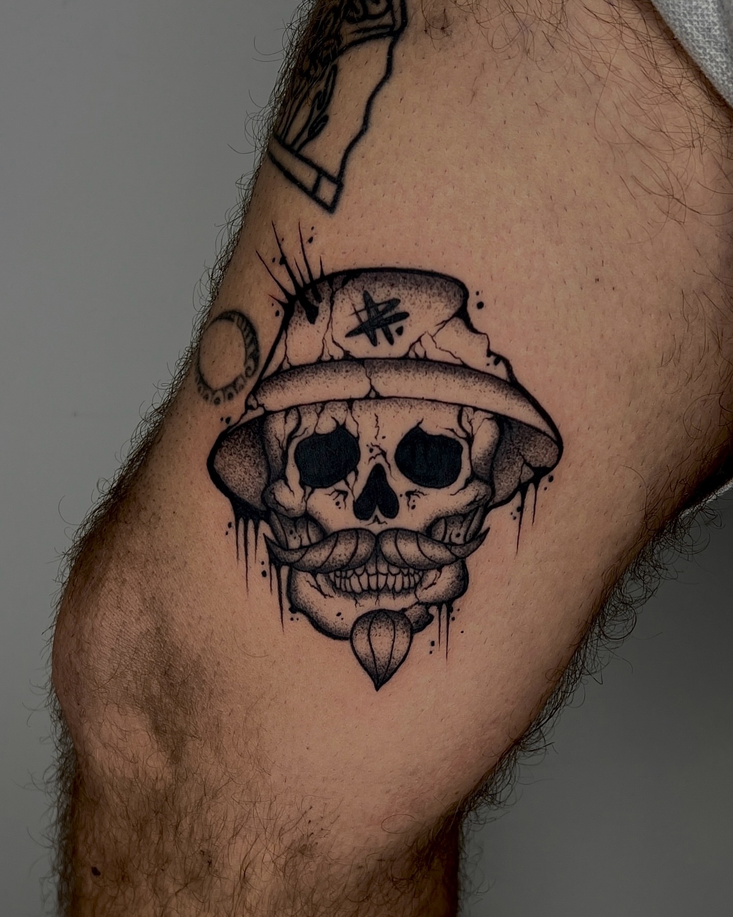 Skull wearing hat dotwork tattoo on the forearm by Rebel milly Tattoo