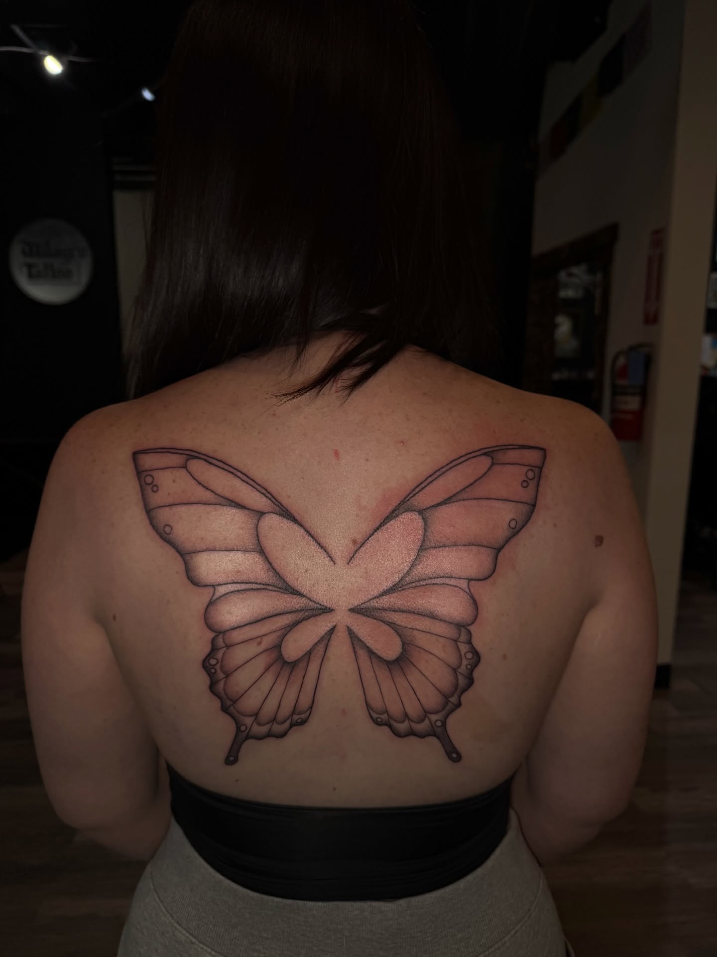 Butterfly realism tattoo on the back by Nathalie Briseno