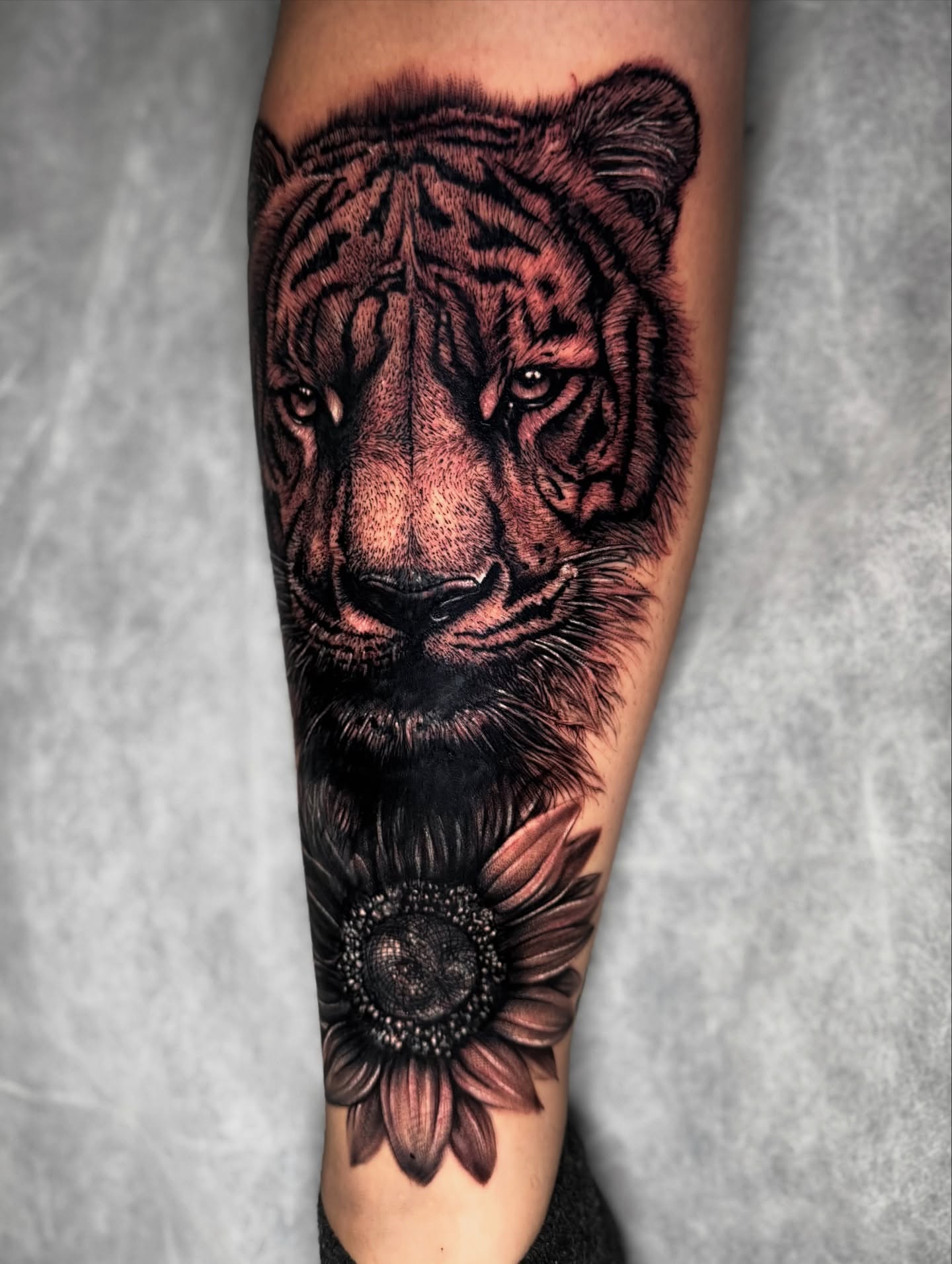 Tiger and sunflower realism tattoo on the forearm by Georgianna Ink, Las Vegas, Nevada