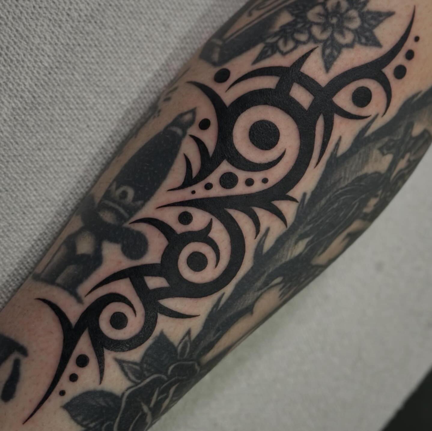 Tribal eyes tribal tattoo on the forearm by Alexa Wolfkiel