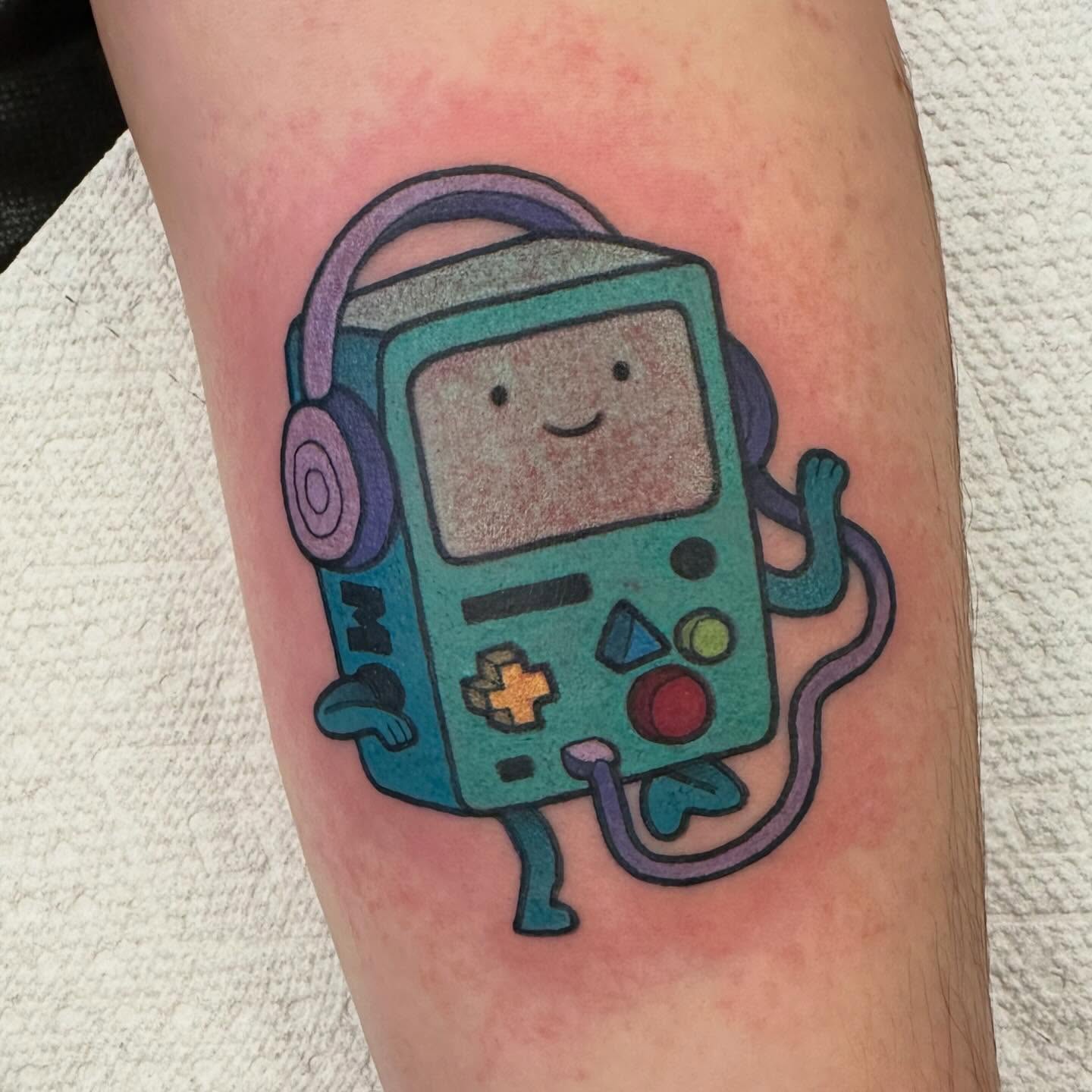 BMO dotwork tattoo on the forearm by Katie Beth