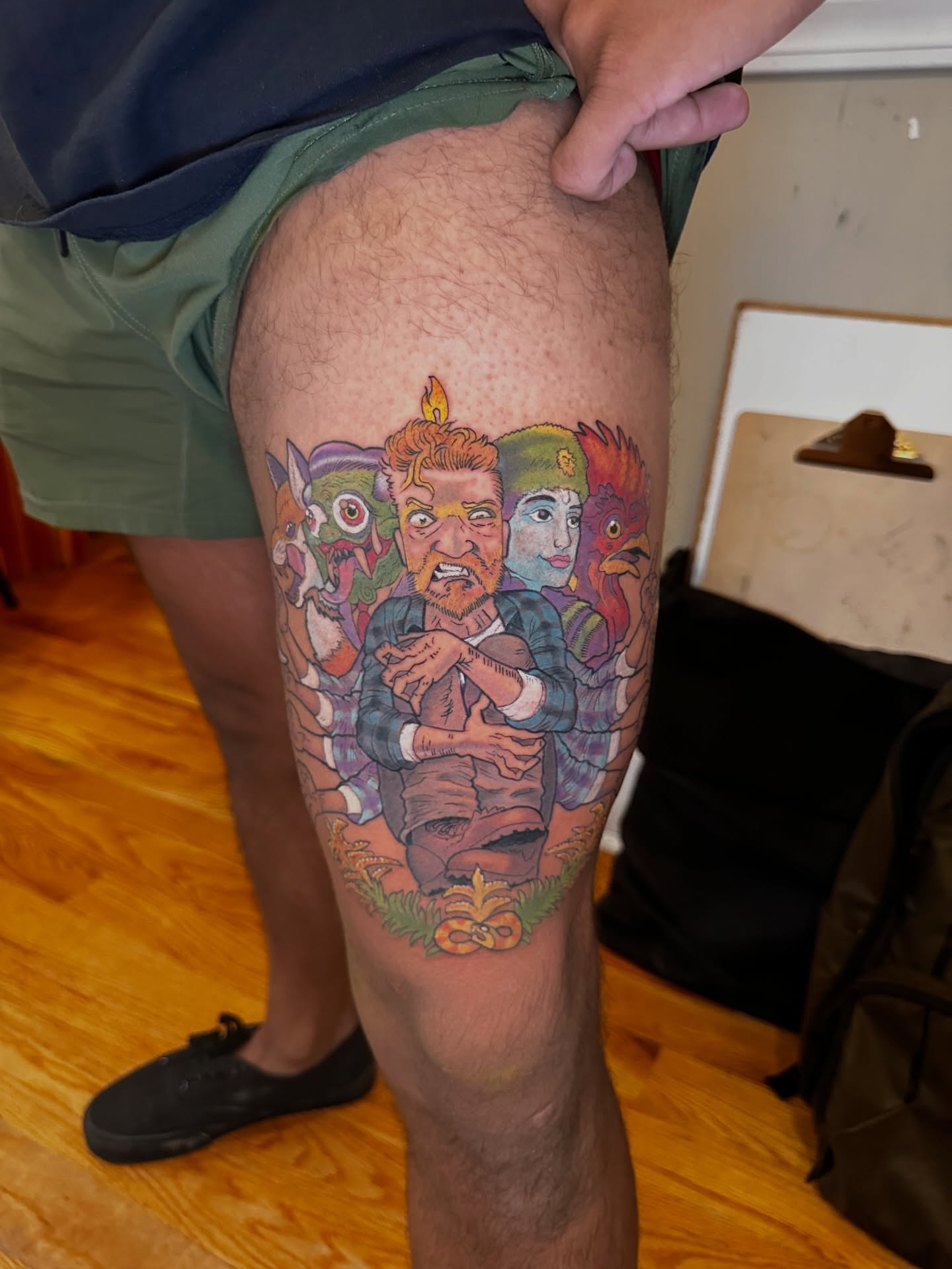 Group of characters illustrative tattoo on the thigh by Kevin R. Onley