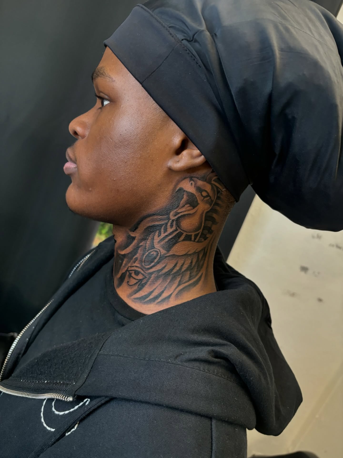 Snake and feathers black and grey tattoo on the neck by FleeDott 🇨🇴