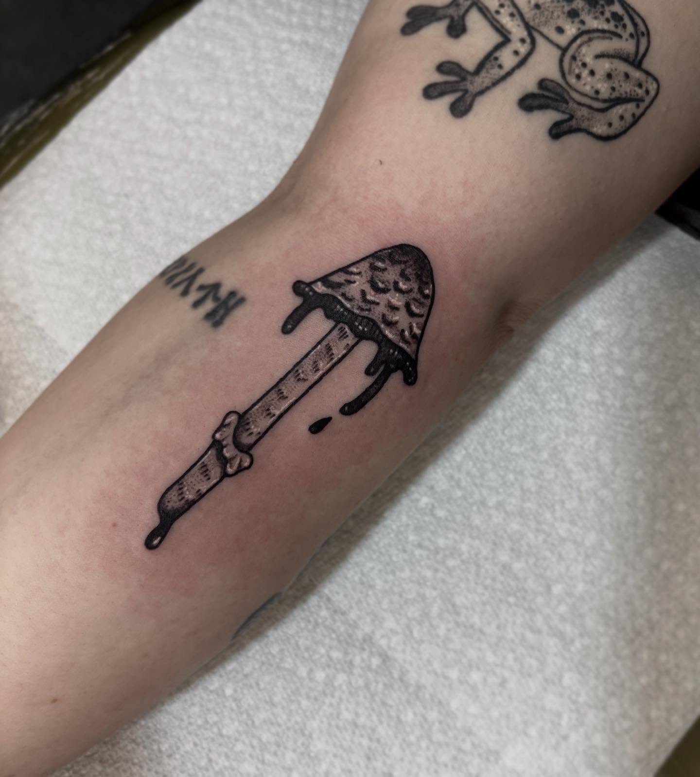 Mushroom knife black and grey tattoo on the forearm by destiney rose