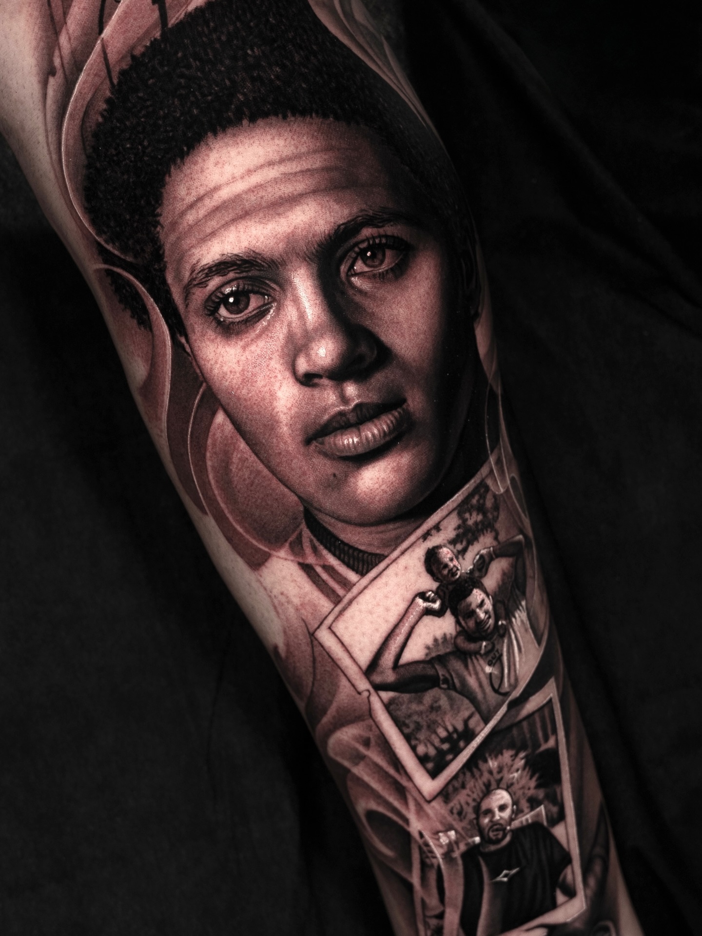 Portrait of a man with photos realism tattoo on the forearm by @_garart_