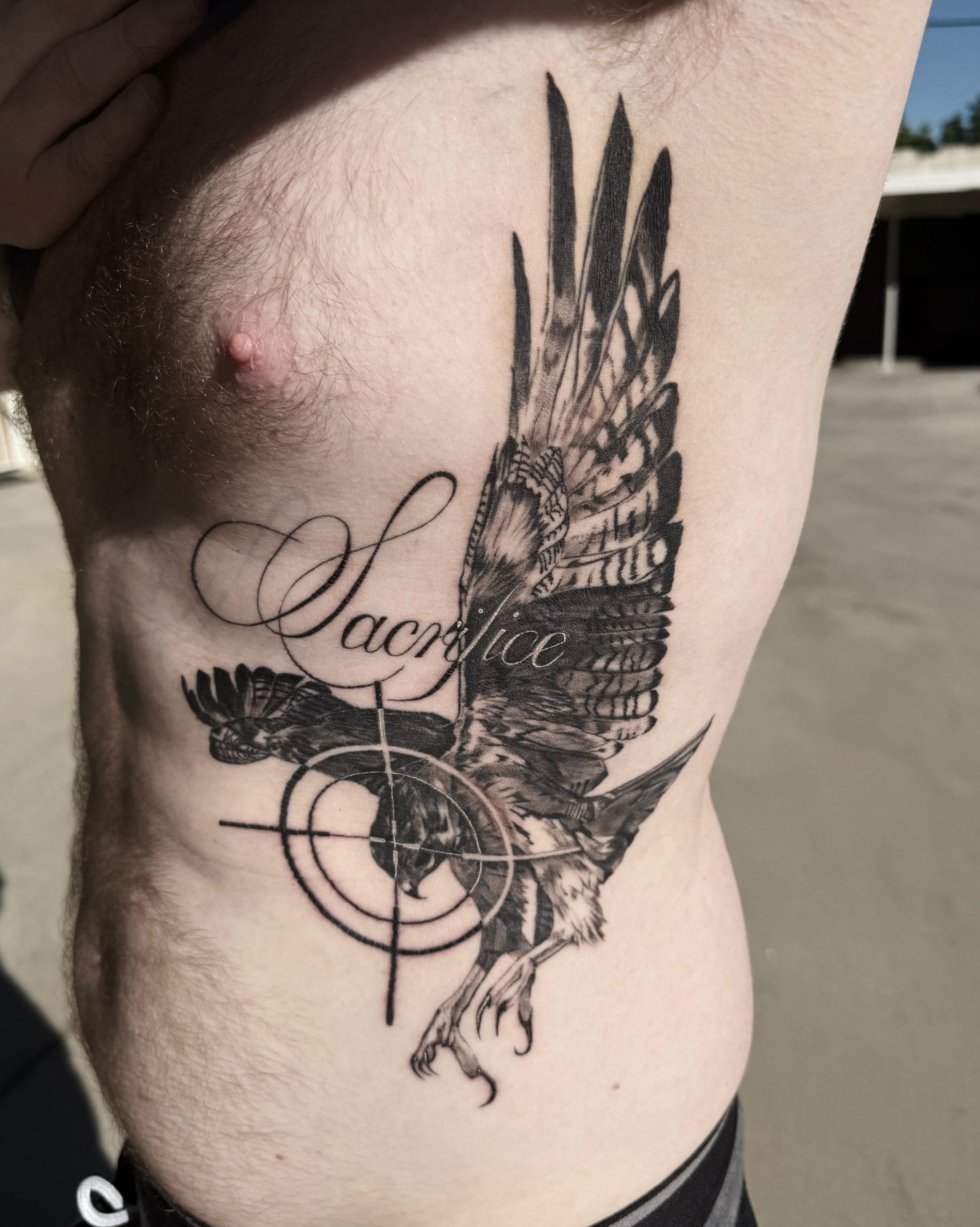 Eagle and target realism tattoo on the ribs by viktoria raquel