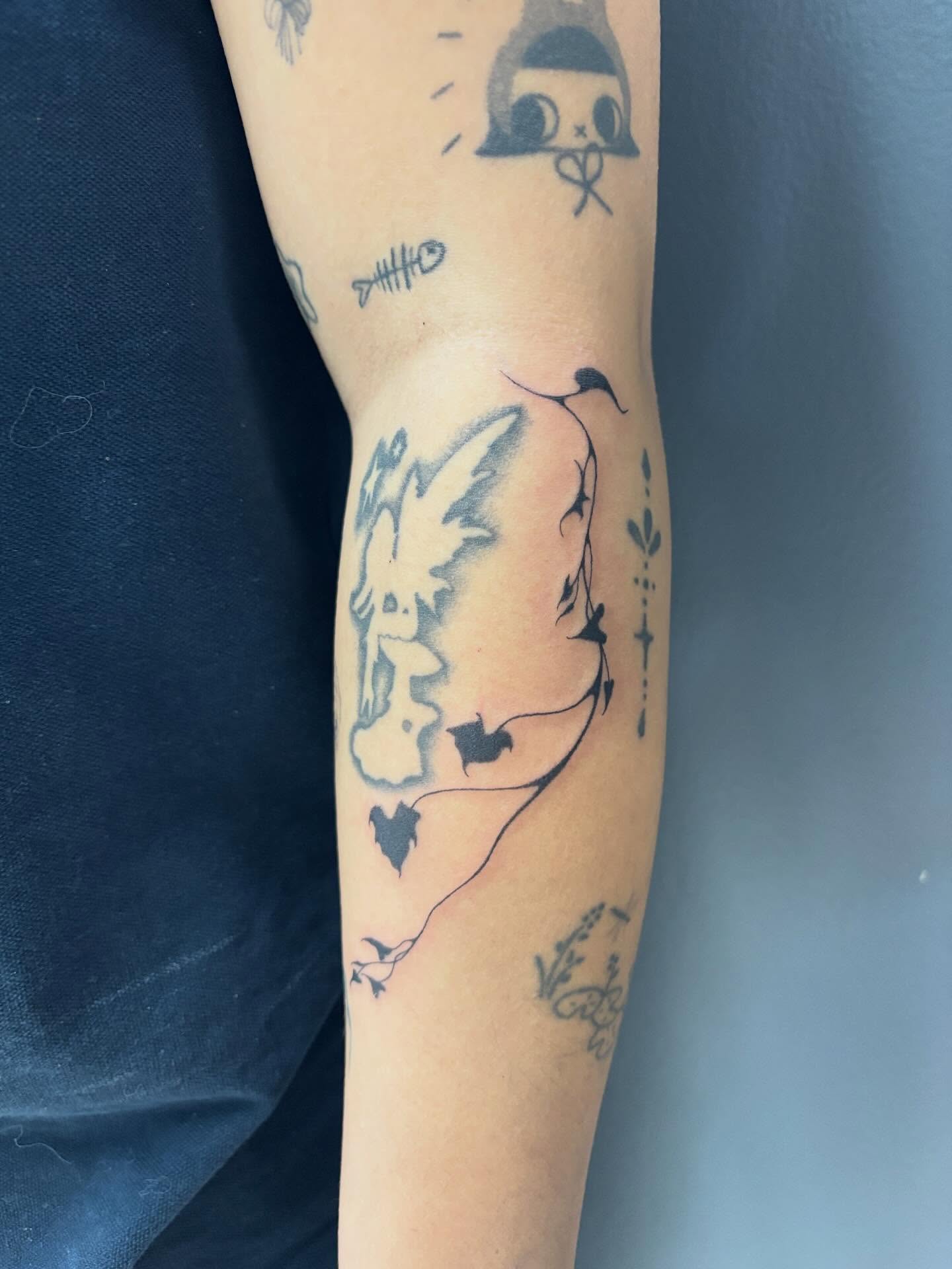 Bird and heart black and grey tattoo on the forearm by ꜱʜɪʀʟᴇʏ