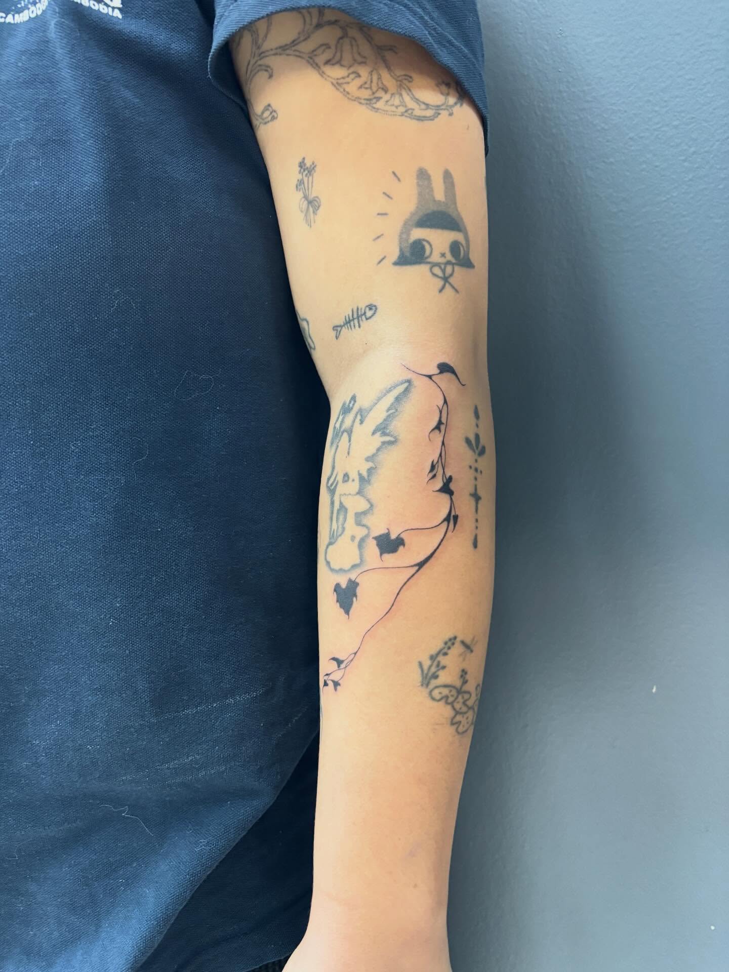 Rabbit and bird black and grey tattoo on the forearm by ꜱʜɪʀʟᴇʏ