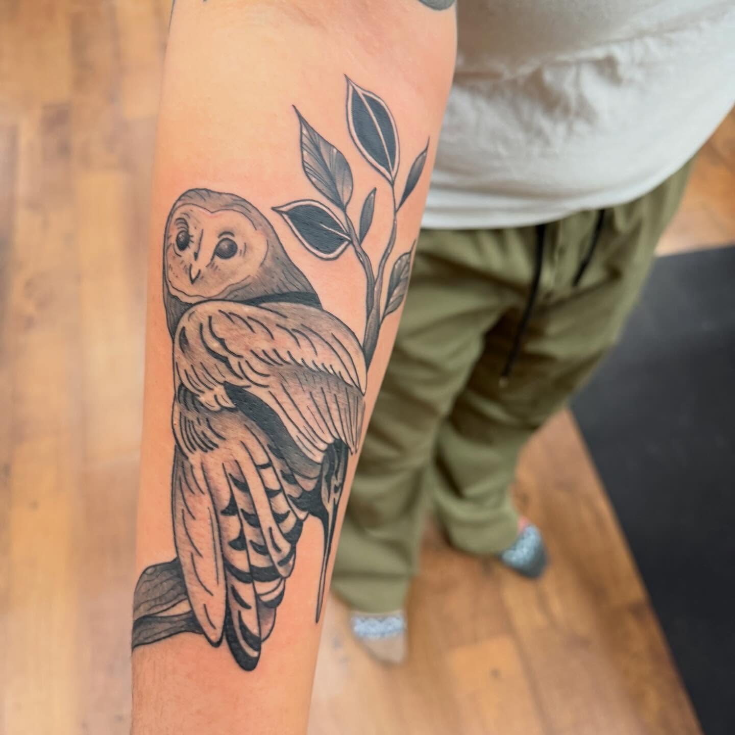 Owl black and grey tattoo on the forearm by Erica Rose π€