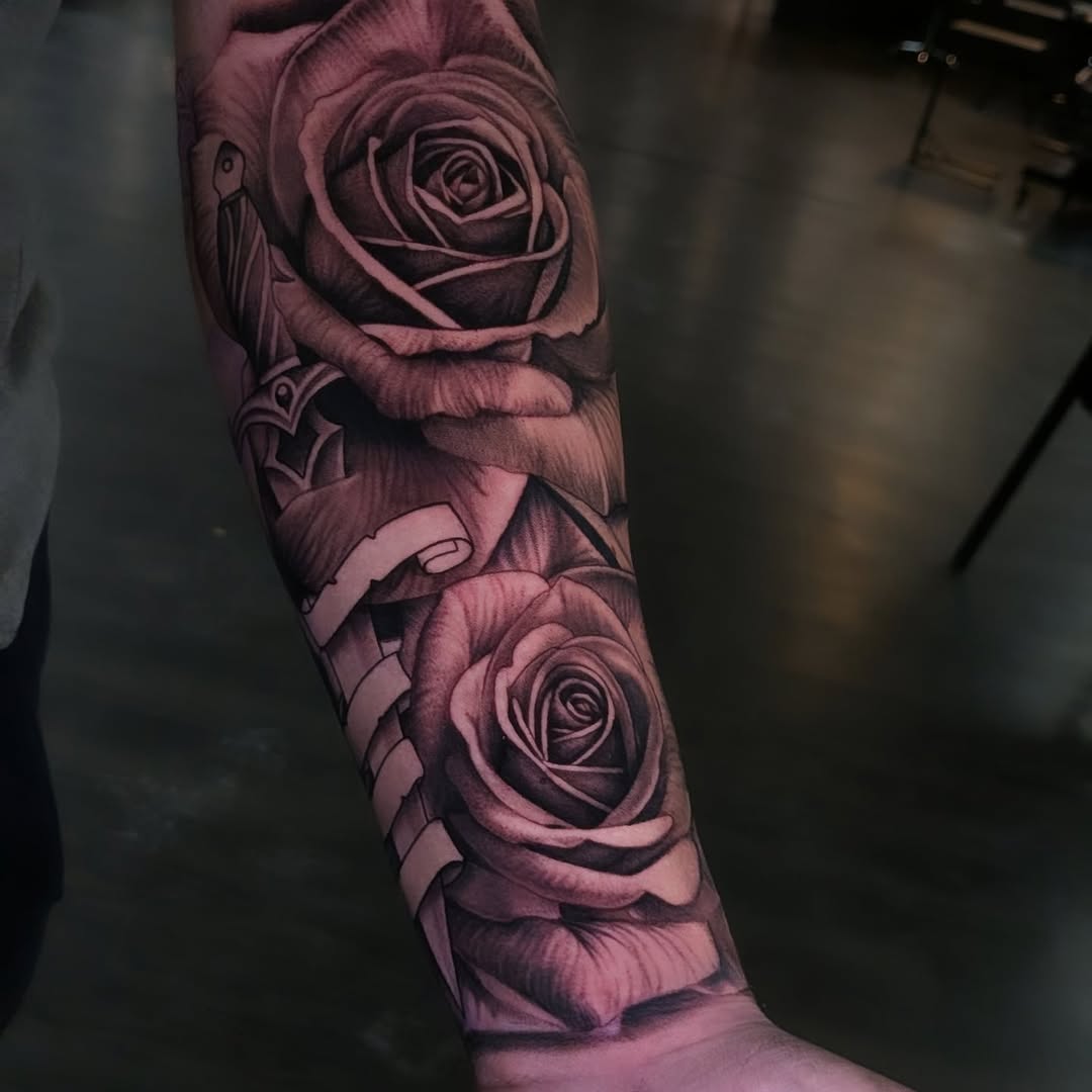 Roses and dagger neo-traditional tattoo on the forearm by Joe Shepp