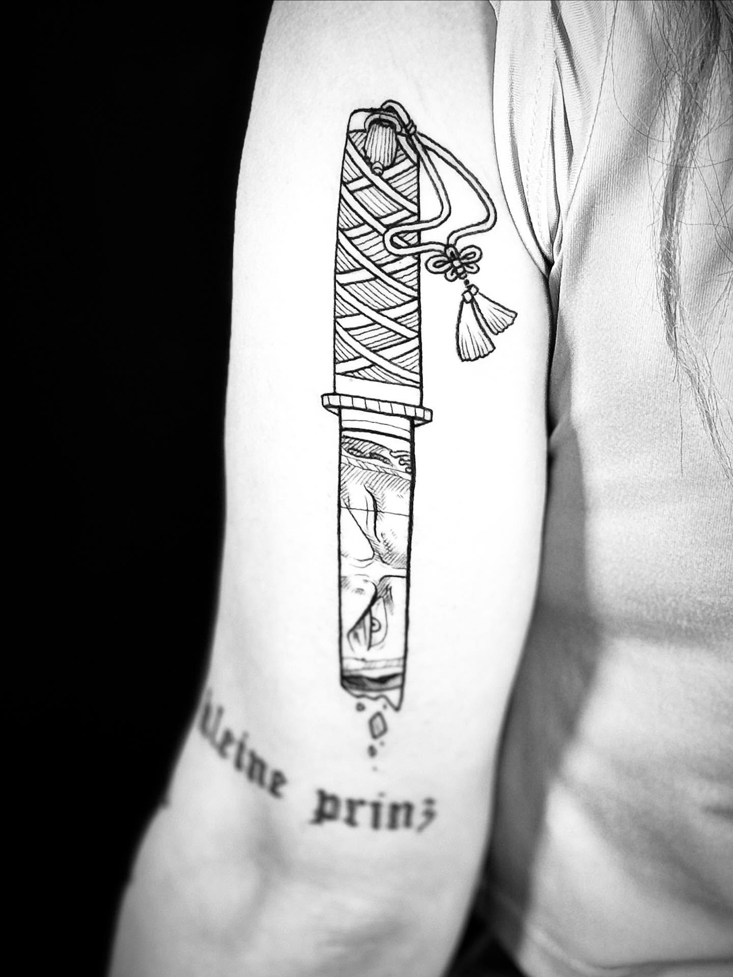 Condom black and grey tattoo on the forearm by Annie Mess