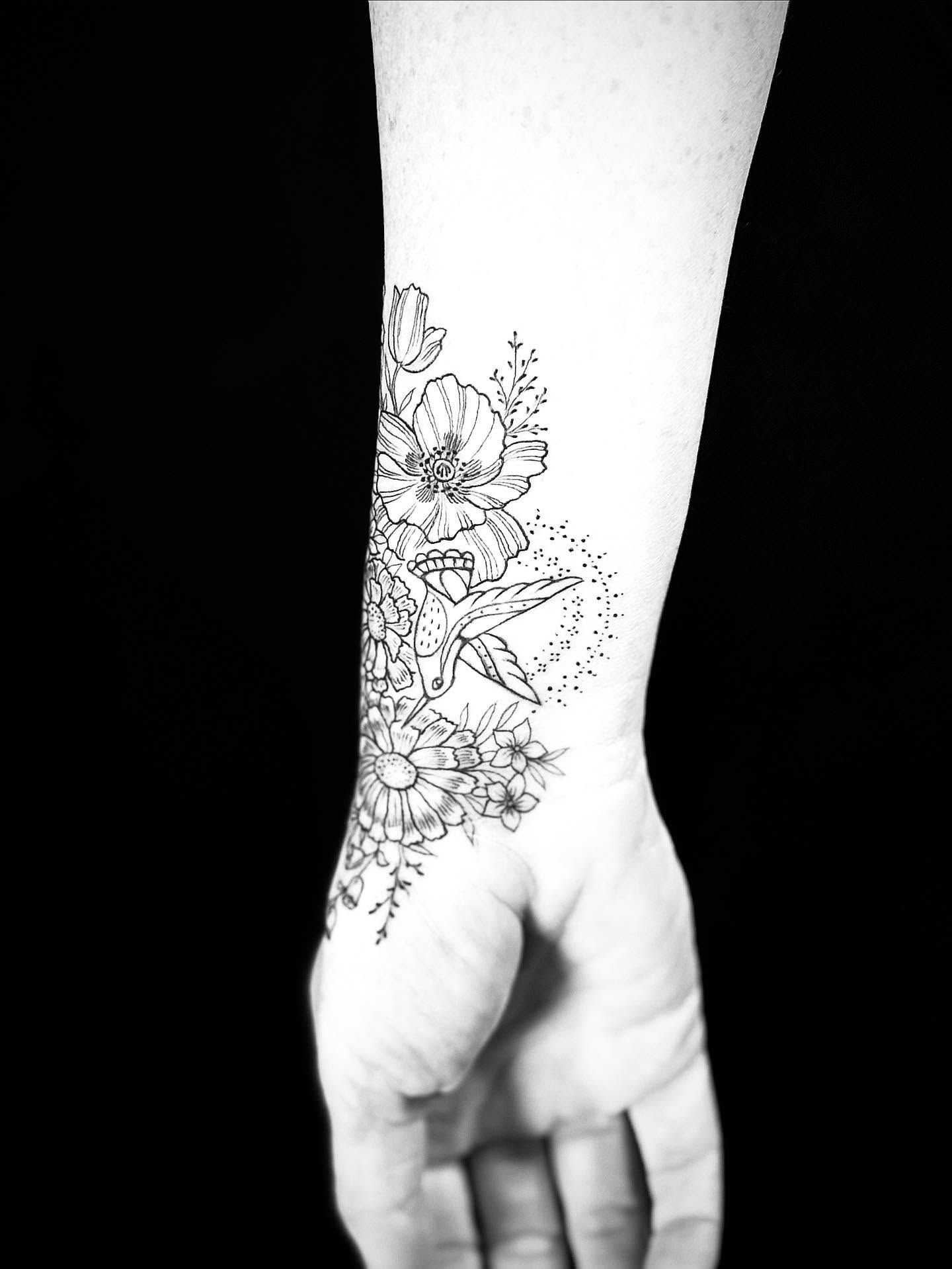 Floral arrangement dotwork tattoo on the forearm by Annie Mess