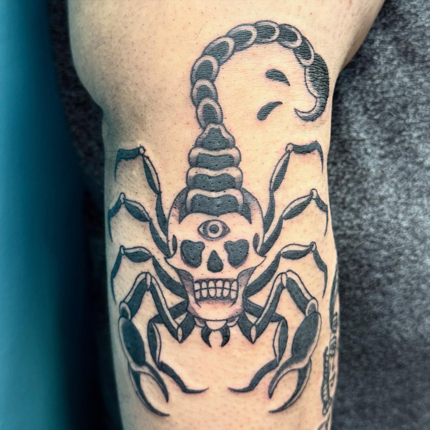 Scorpion black and grey tattoo on the forearm by Rigo Vargas