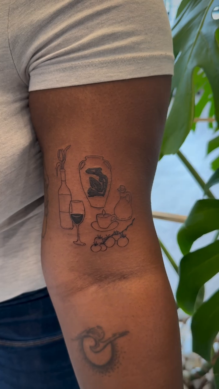 Wine bottle and glasses minimalist tattoo on the forearm by Jennifer Fuster