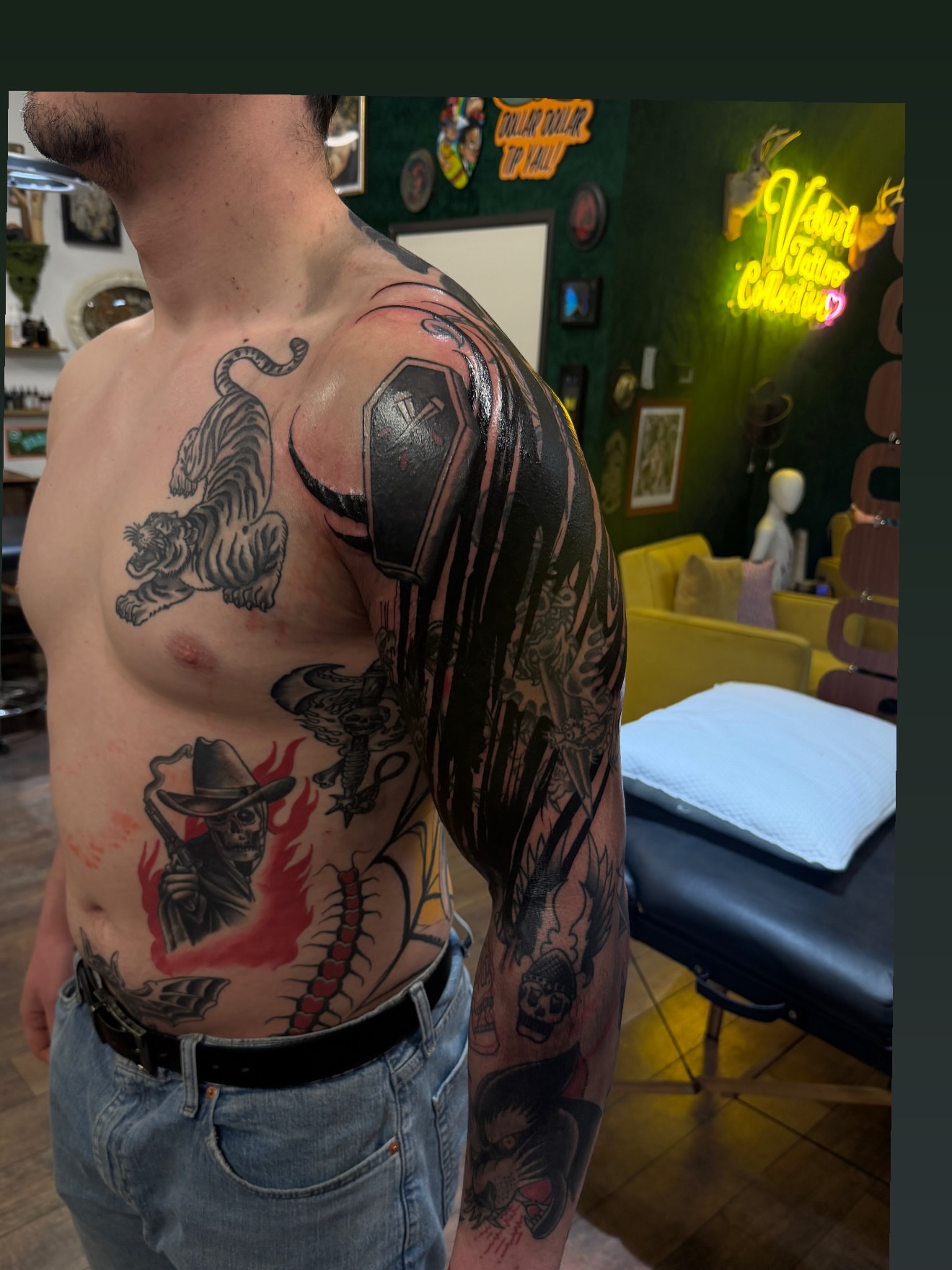 Tiger and coffin American traditional tattoo on the chest by Denver Blackout Tattoo Specialist - Anthony