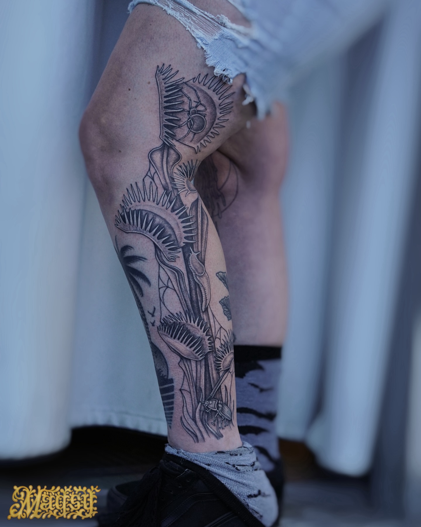 Sun and plant black and grey tattoo on the forearm by Magsy, Orange, California