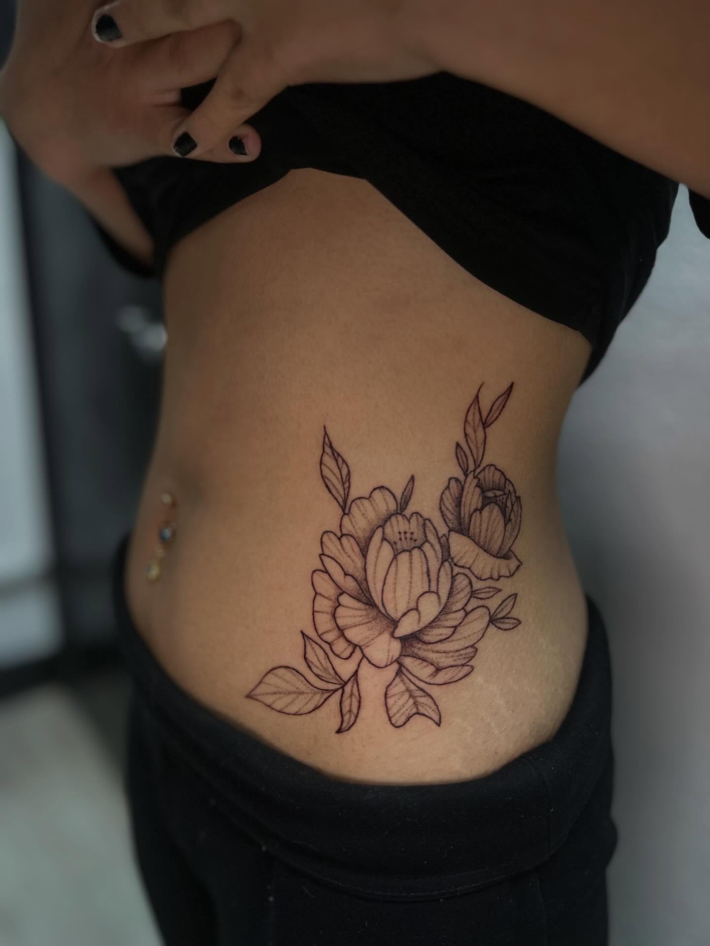Floral bouquet black and grey tattoo on the torso by Cherry Tats🍒