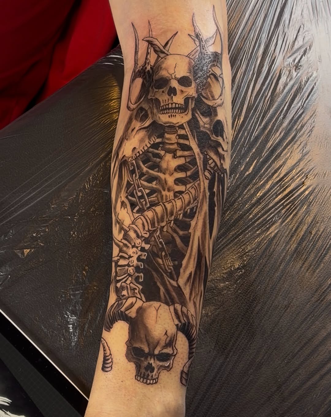 Grim reaper skeleton with skulls realism tattoo on the forearm by 🐺